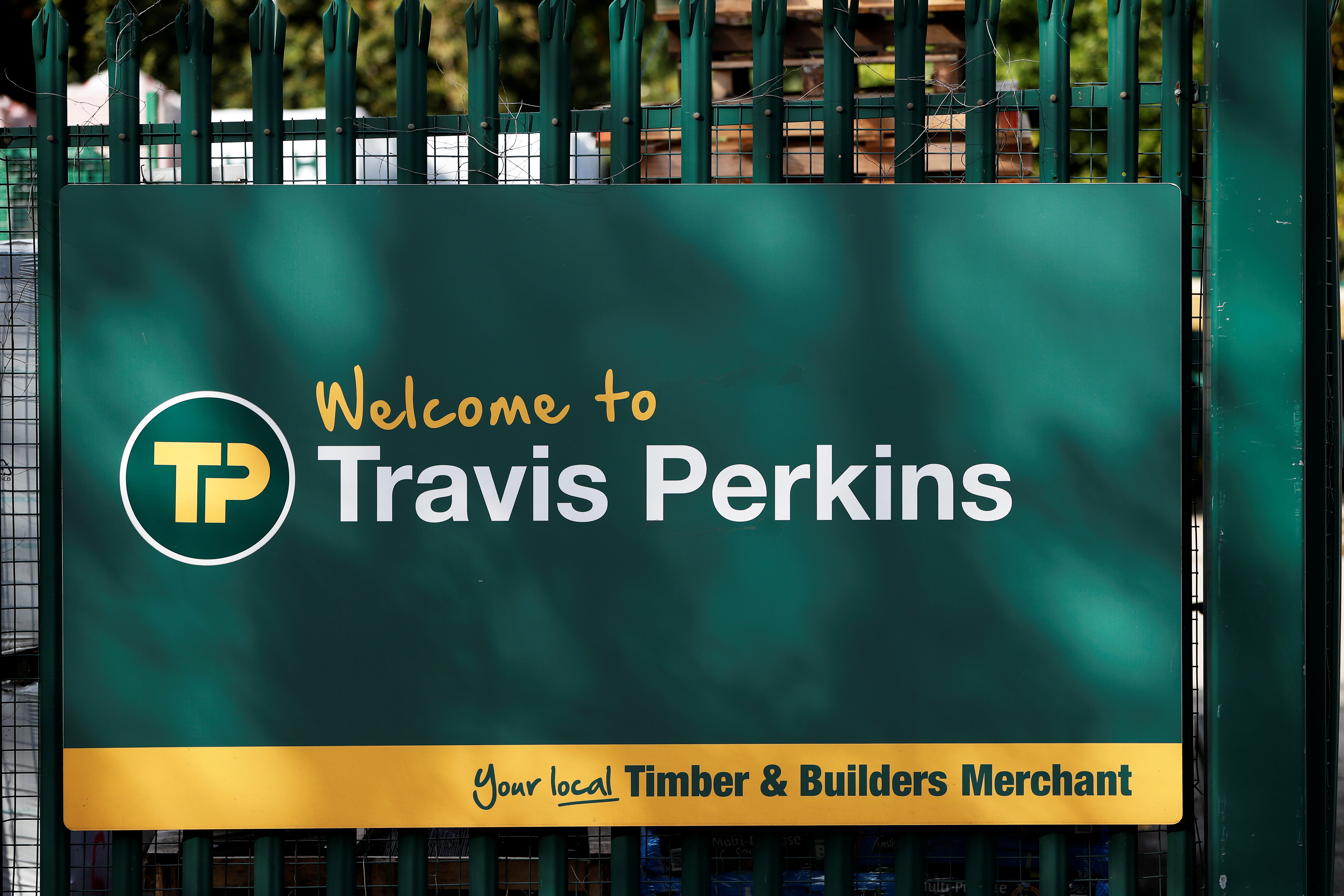 Signage is pictured at Travis Perkins, a timber and building merchants yard in St Albans