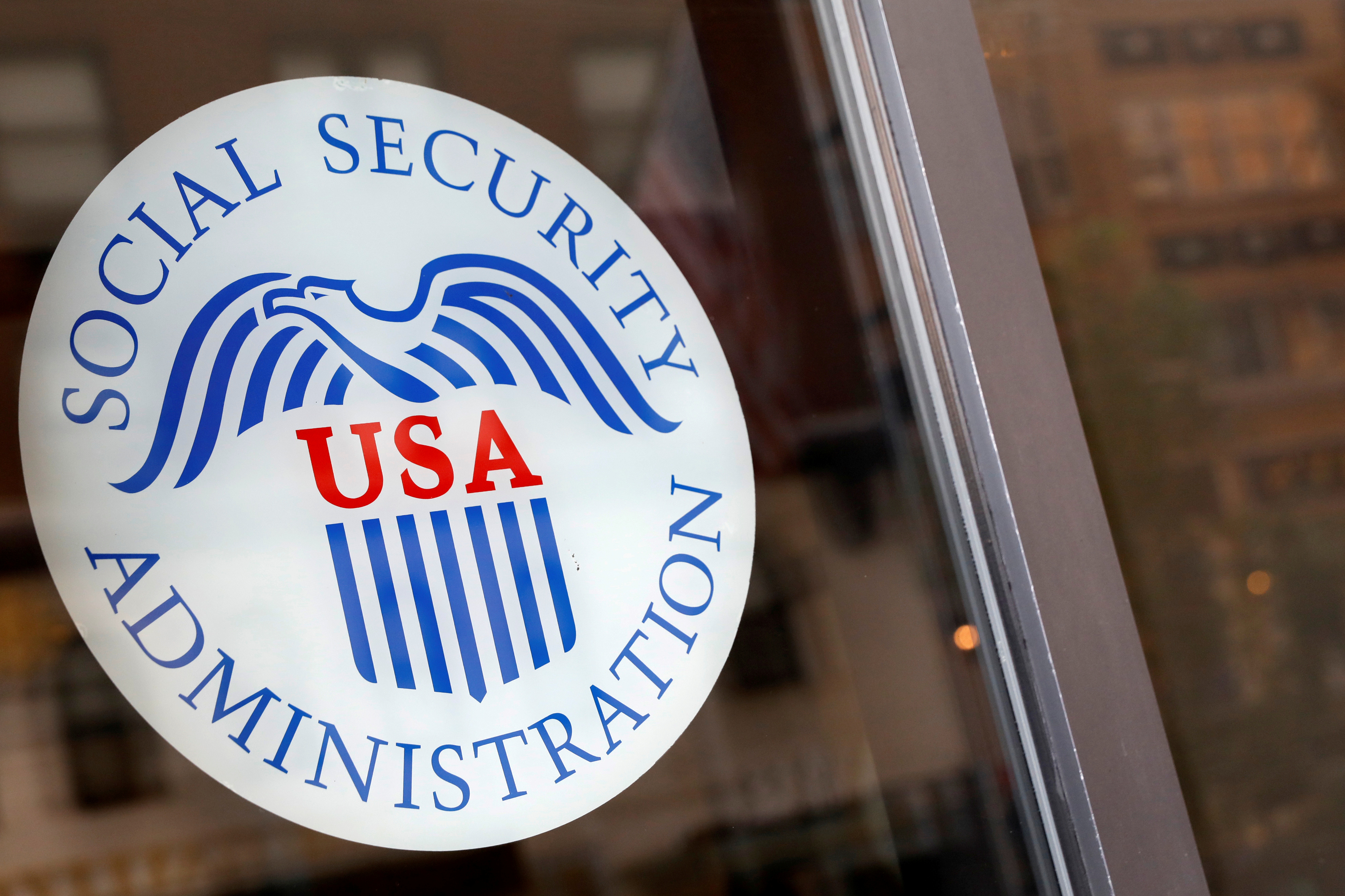 FILE PHOTO Sign is seen on the entrance to a Social Security office in New York