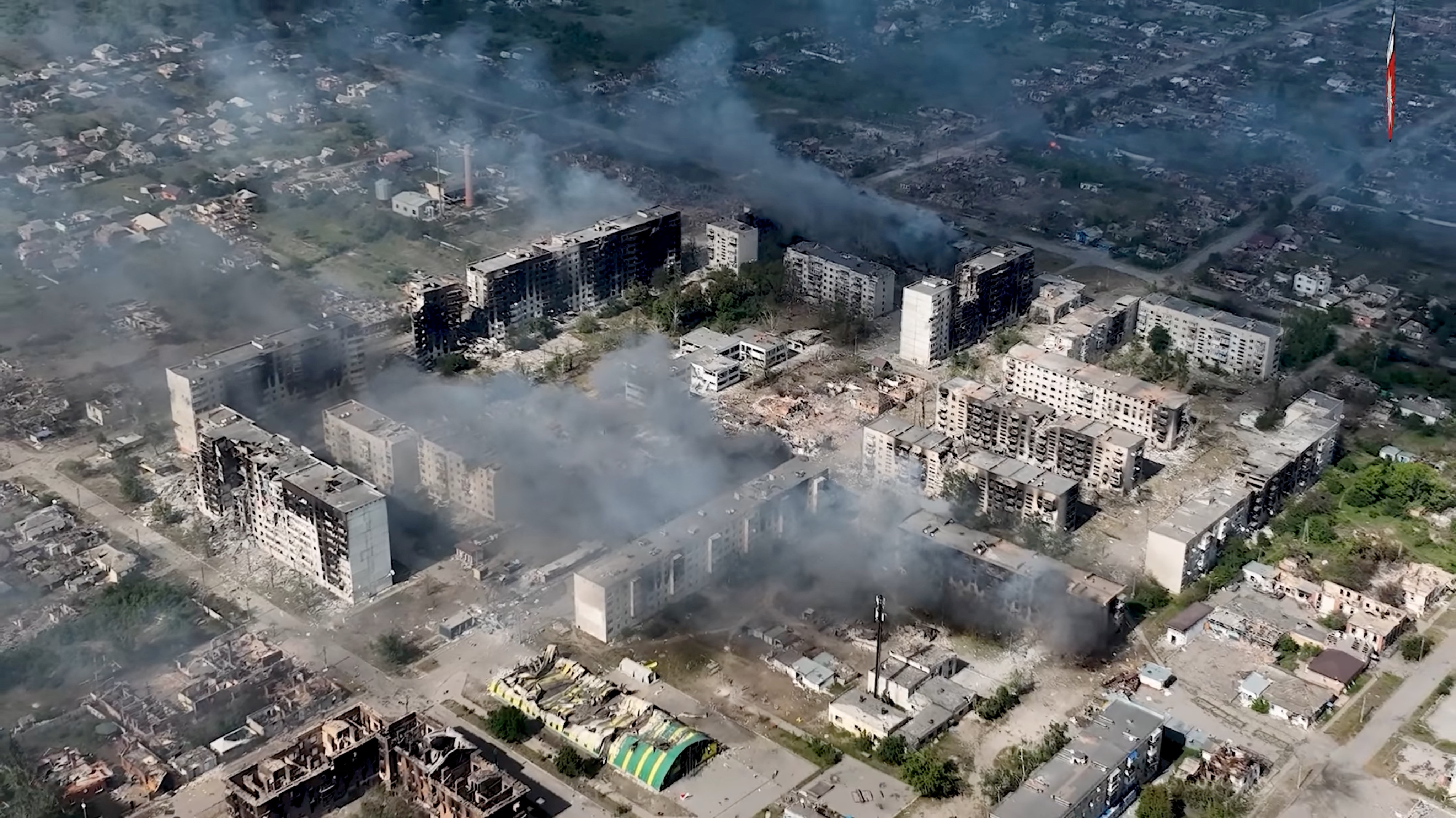A drone view shows damaged property, in Vovchansk