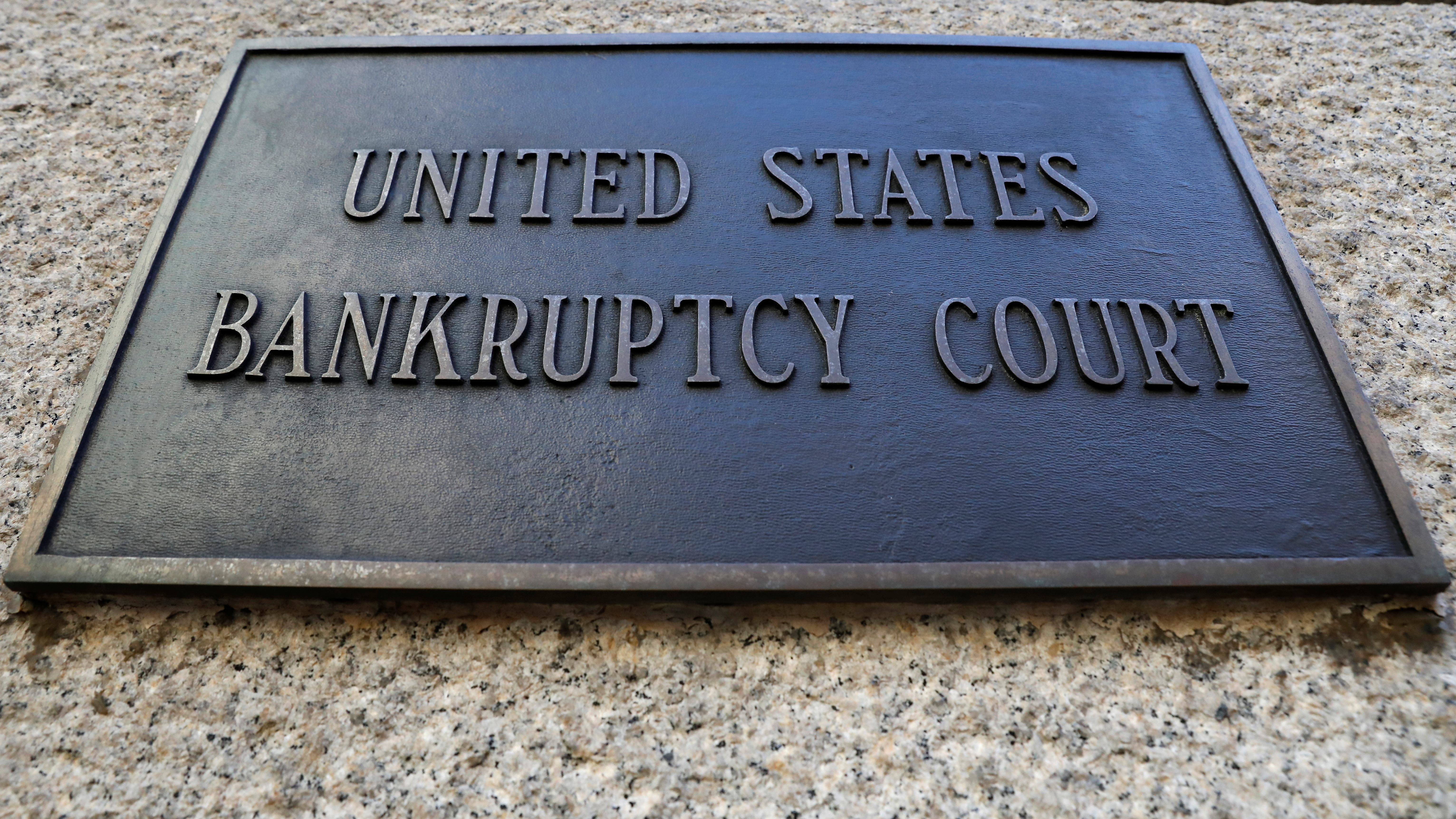 A plaque is displayed at the entrance of the U.S. District Bankruptcy Court for the Southern District of New York in New York