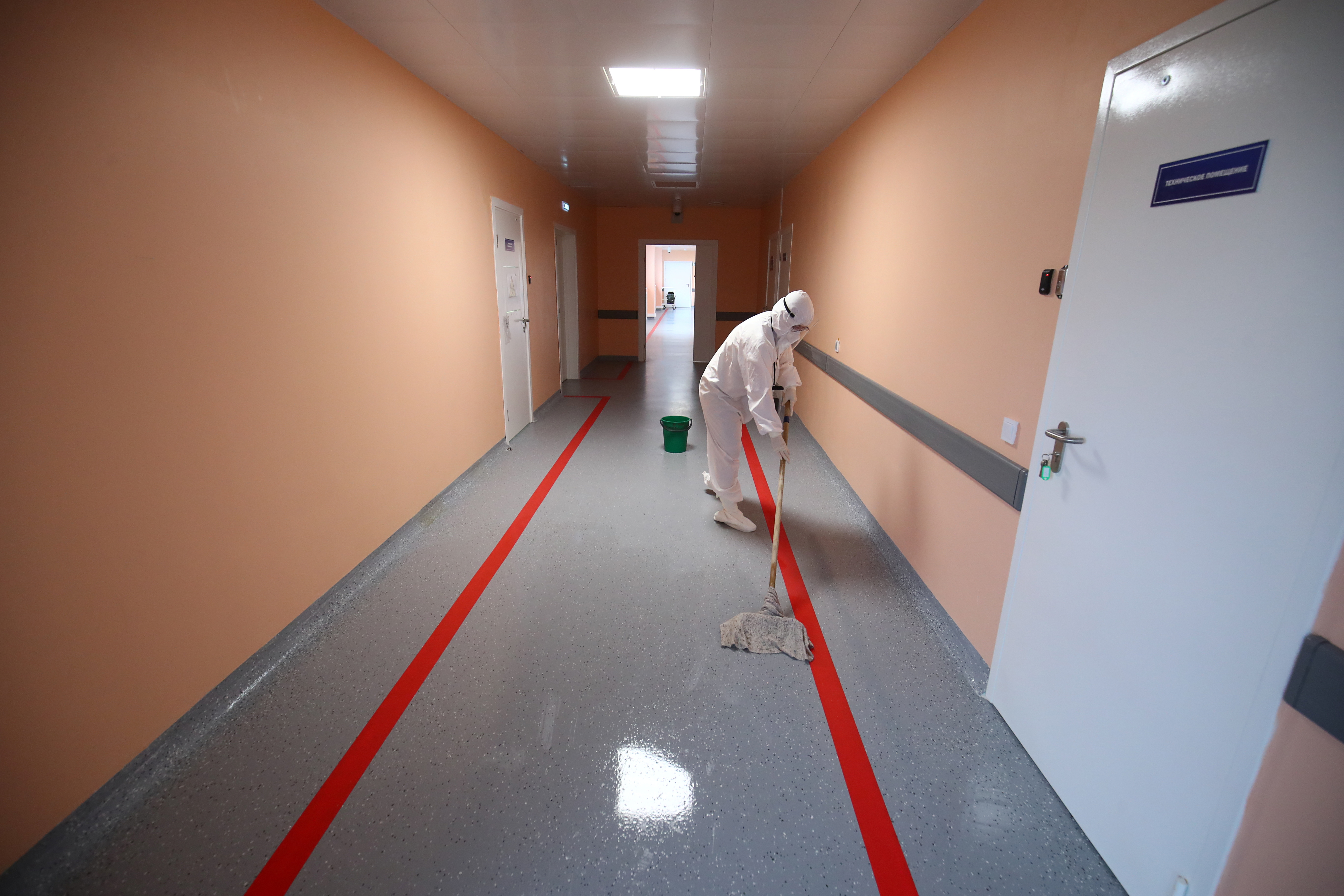 A worker cleans the floor in a local hospital where patients suffering from the coronavirus disease (COVID-19) are treated in Kalach-on-Don