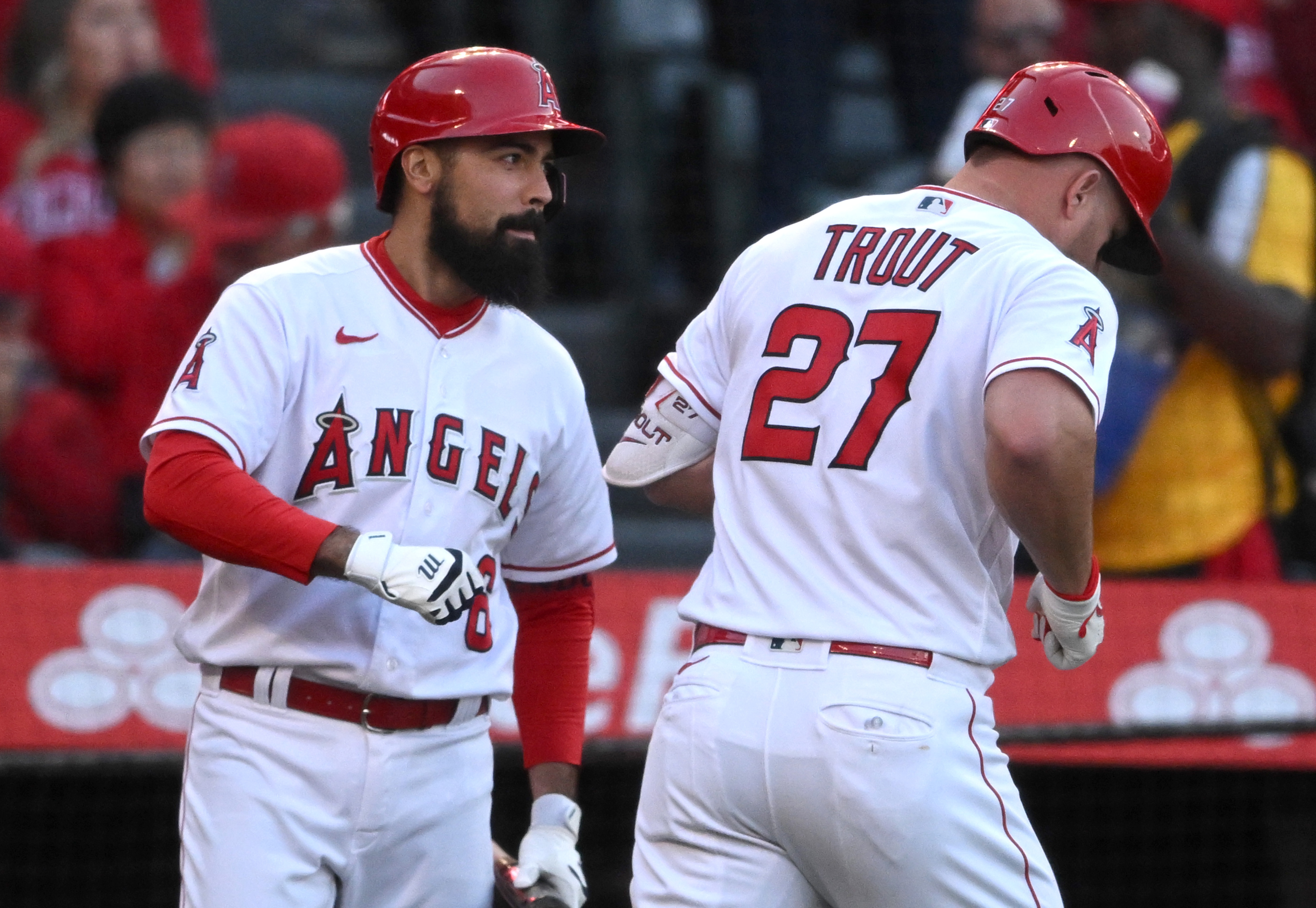 Los Angeles Angels center fielder Mike Trout (27) and right fielder Mickey  Moniak (16) celebrate after a 6-2 win over the Chicago Cubs in a baseball  game in Anaheim, Calif., Wednesday, June