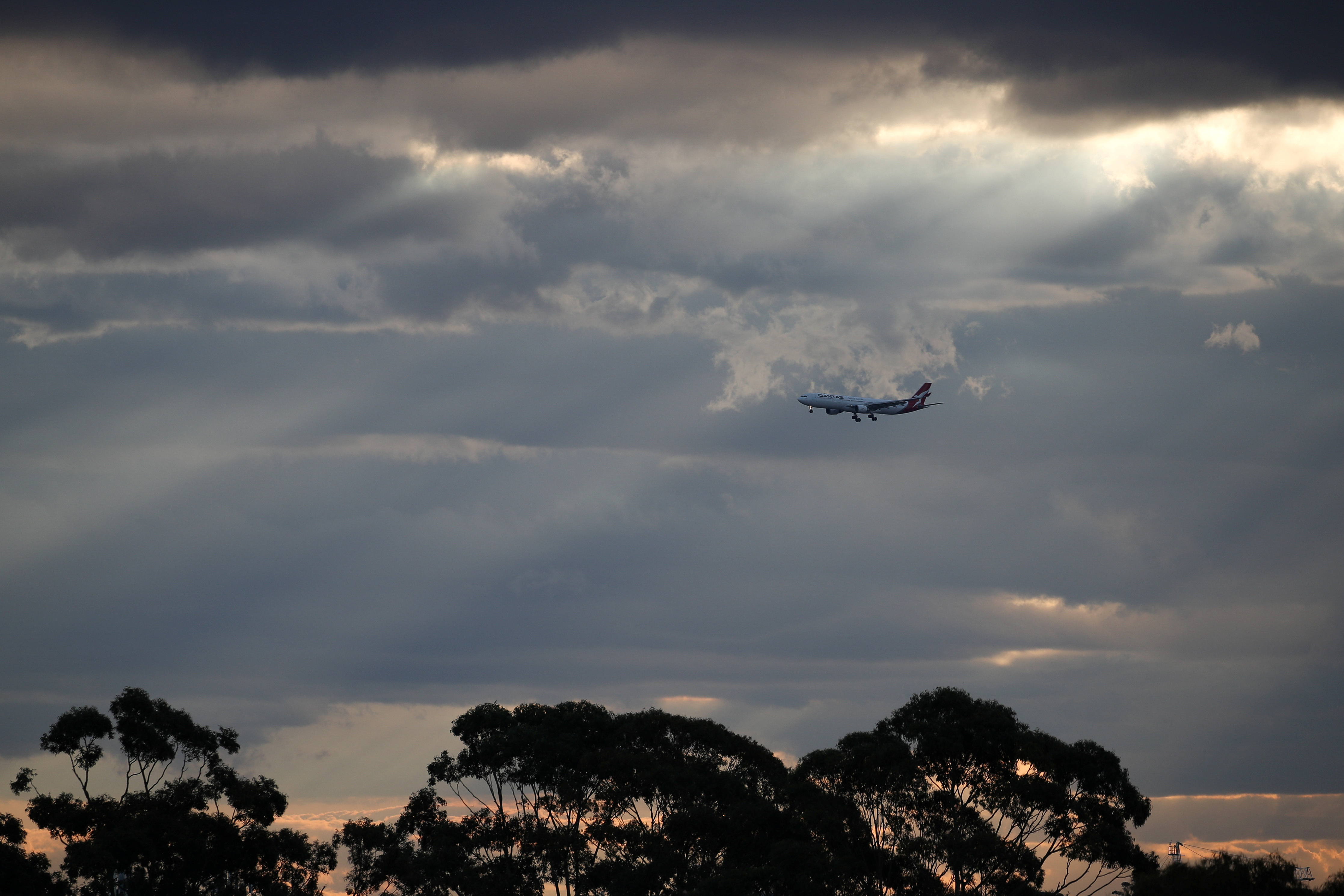 A Qantas plane approaches Kingsford Smith International Airport in Sydney