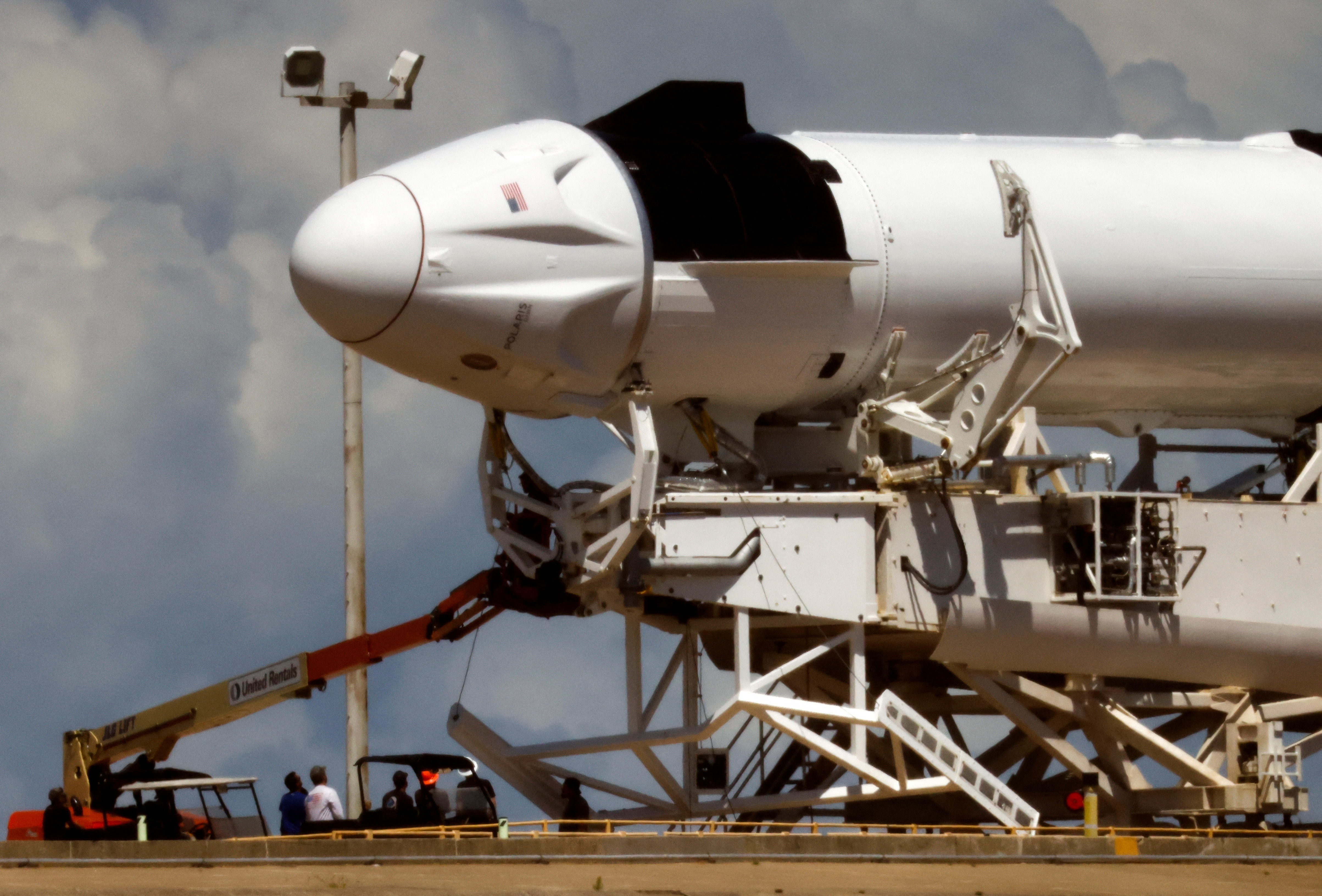 A SpaceX Falcon 9 rocket is prepared, after a delay, for launch of Polaris Dawn, a private human spaceflight mission, at the Kennedy Space Center in Cape Canaveral,