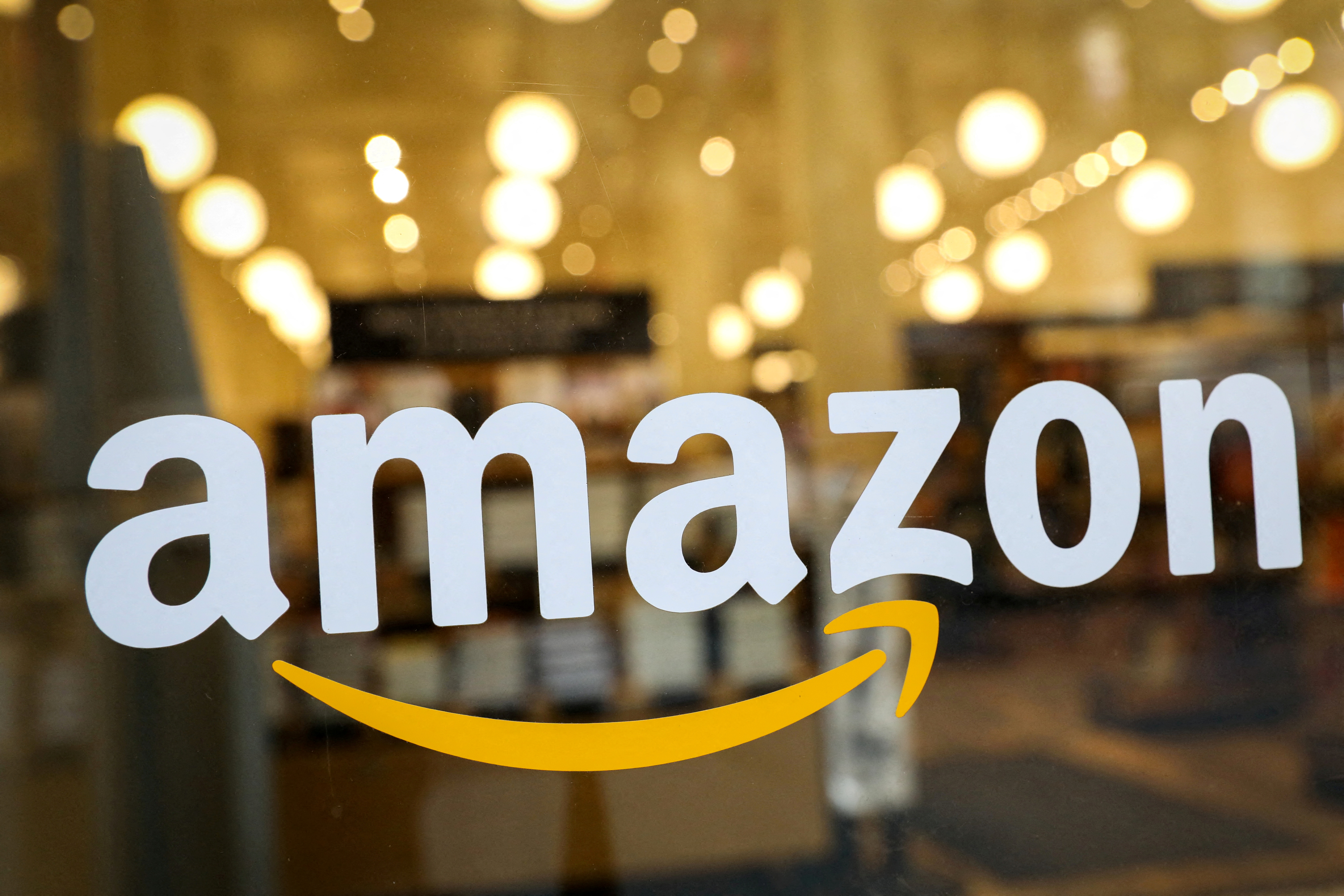 The logo of Amazon is seen on the door of an Amazon Books retail store in New York