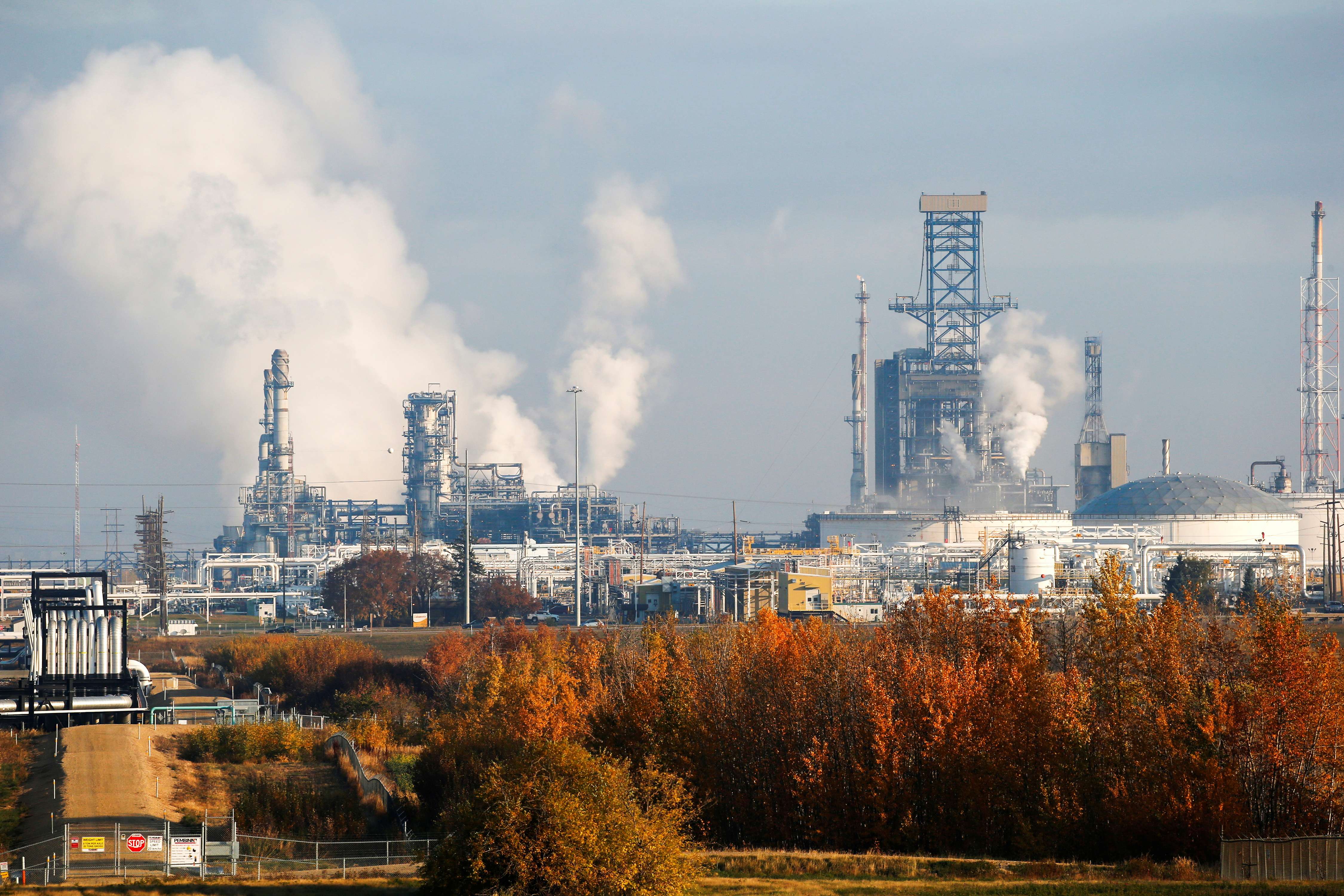 Multiple refineries including the Kinder Morgan Edmonton Terminal, that produces petrochemicals, is seen near Edmonton