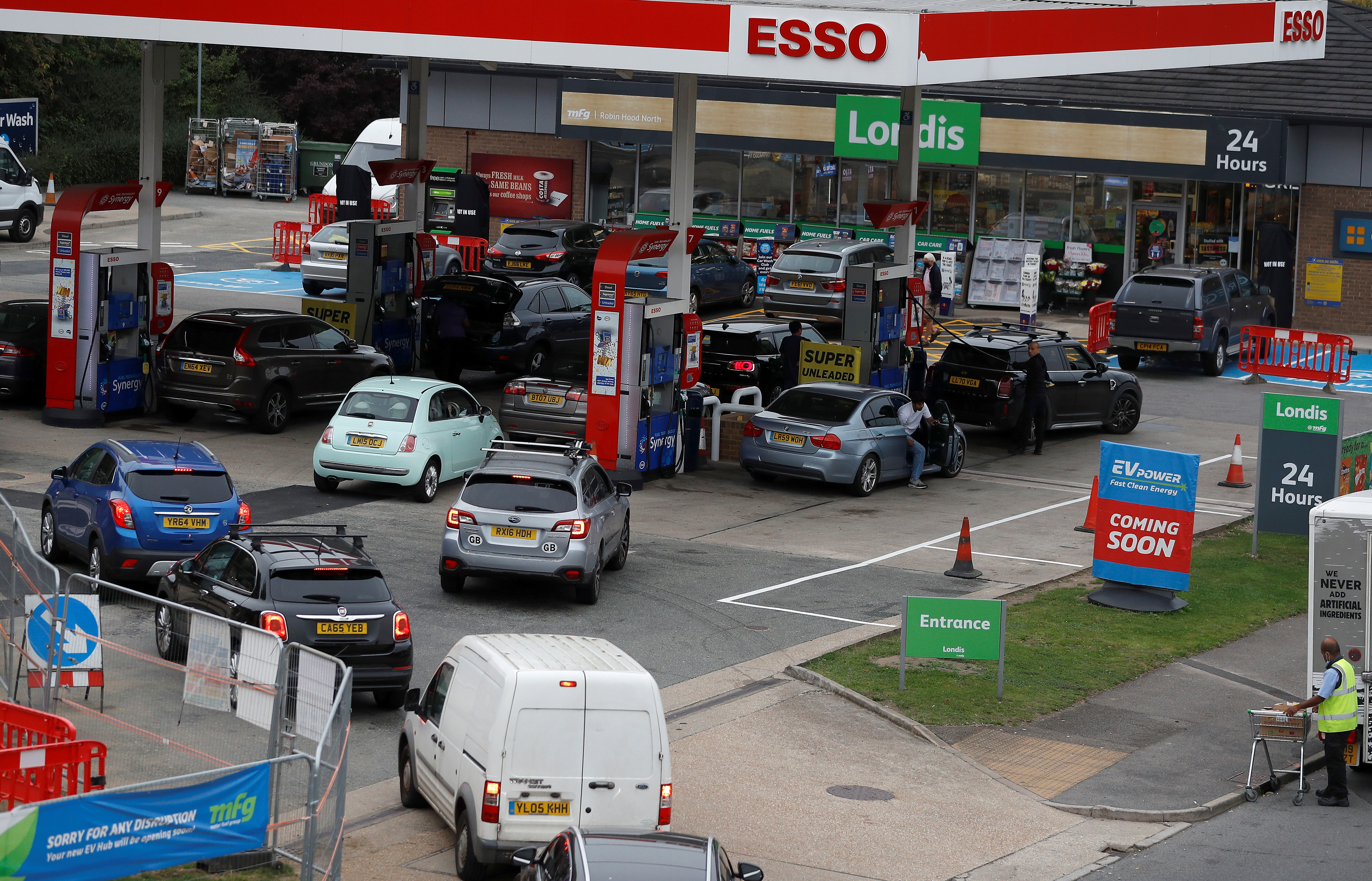 Drivers queue to enter a fuel station in London