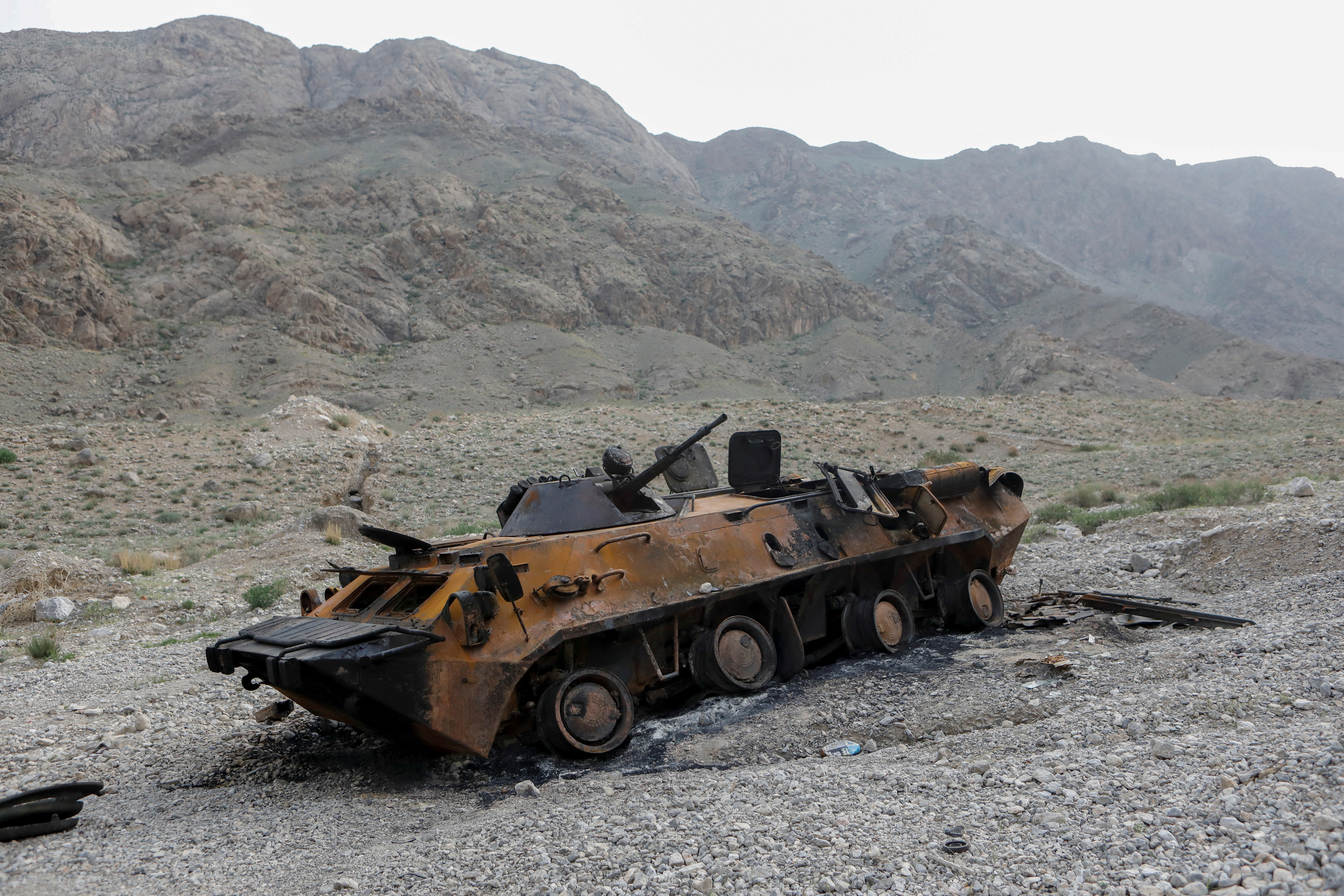 A view shows a burnt armoured vehicle of Kyrgyz forces near a water distribution facility in Batken province