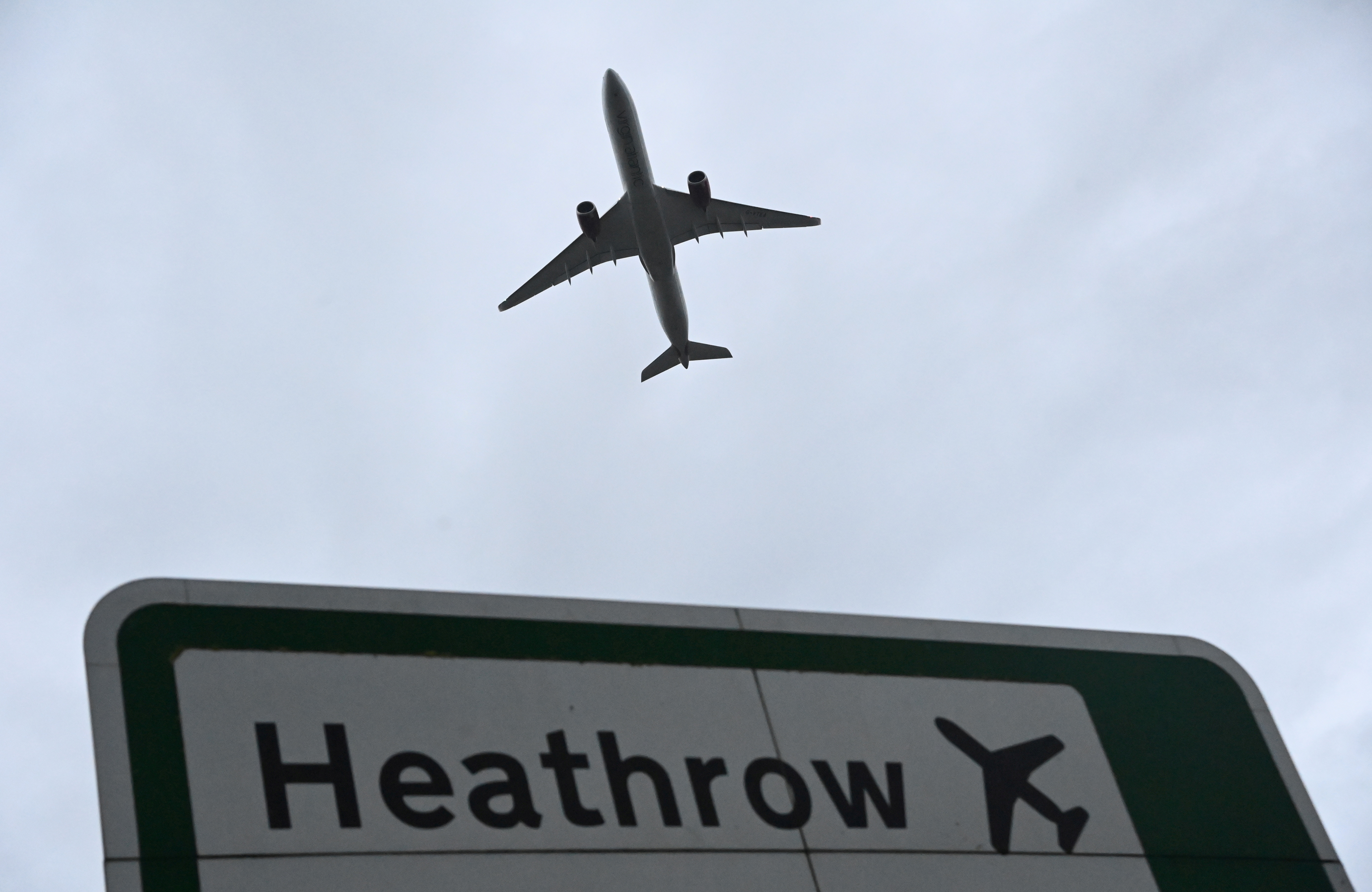 An aircraft takes off at Heathrow Airport amid the spread of the coronavirus disease (COVID-19) pandemic in London, Britain, February 4, 2021. REUTERS/Toby Melville/File Photo