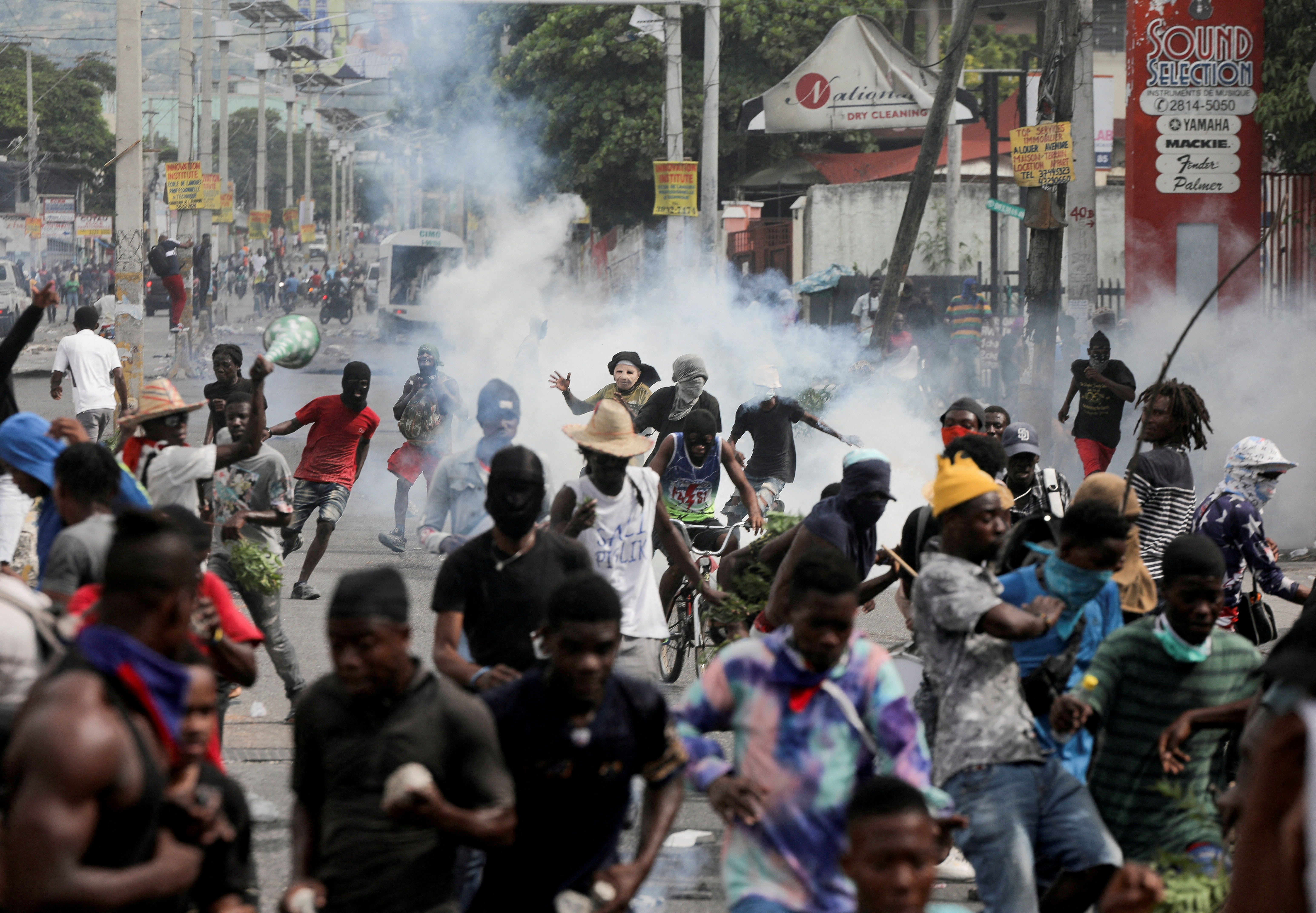 Demonstrators take part in a protest demanding the resignation of Haiti's Prime Minister Ariel Henry
