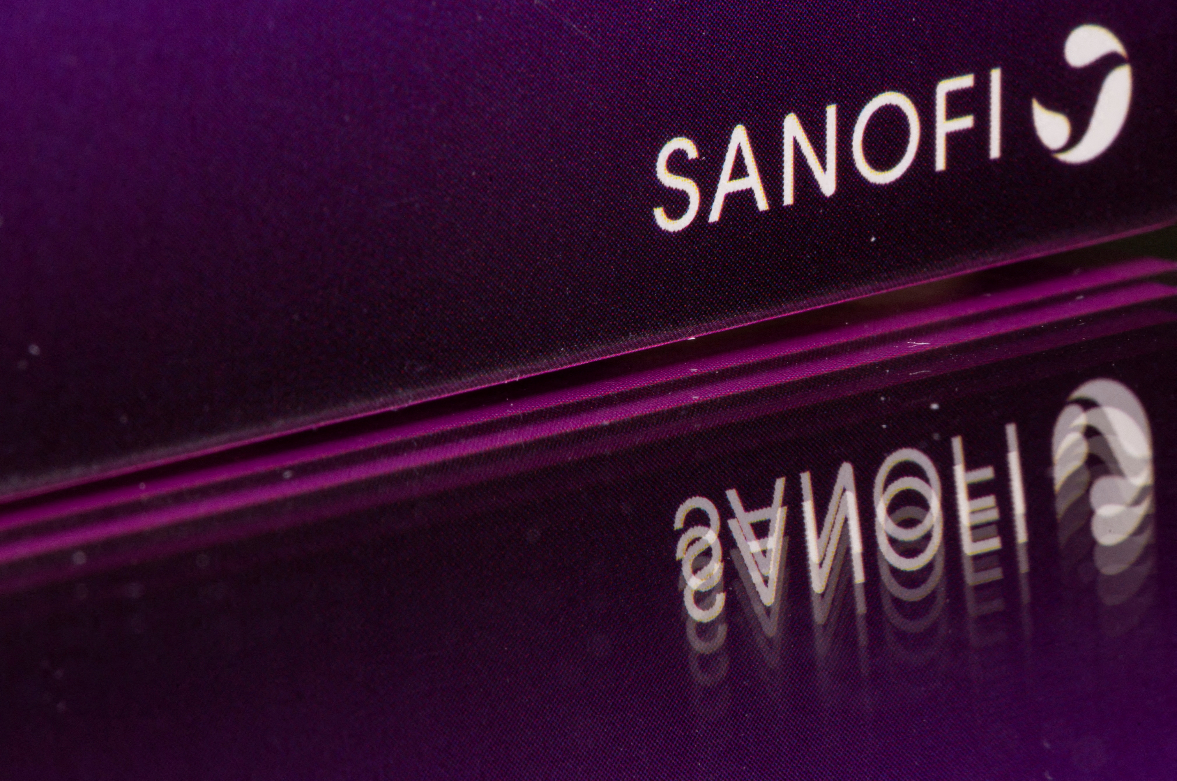 The Sanofi logo is seen on a product box in this illustration