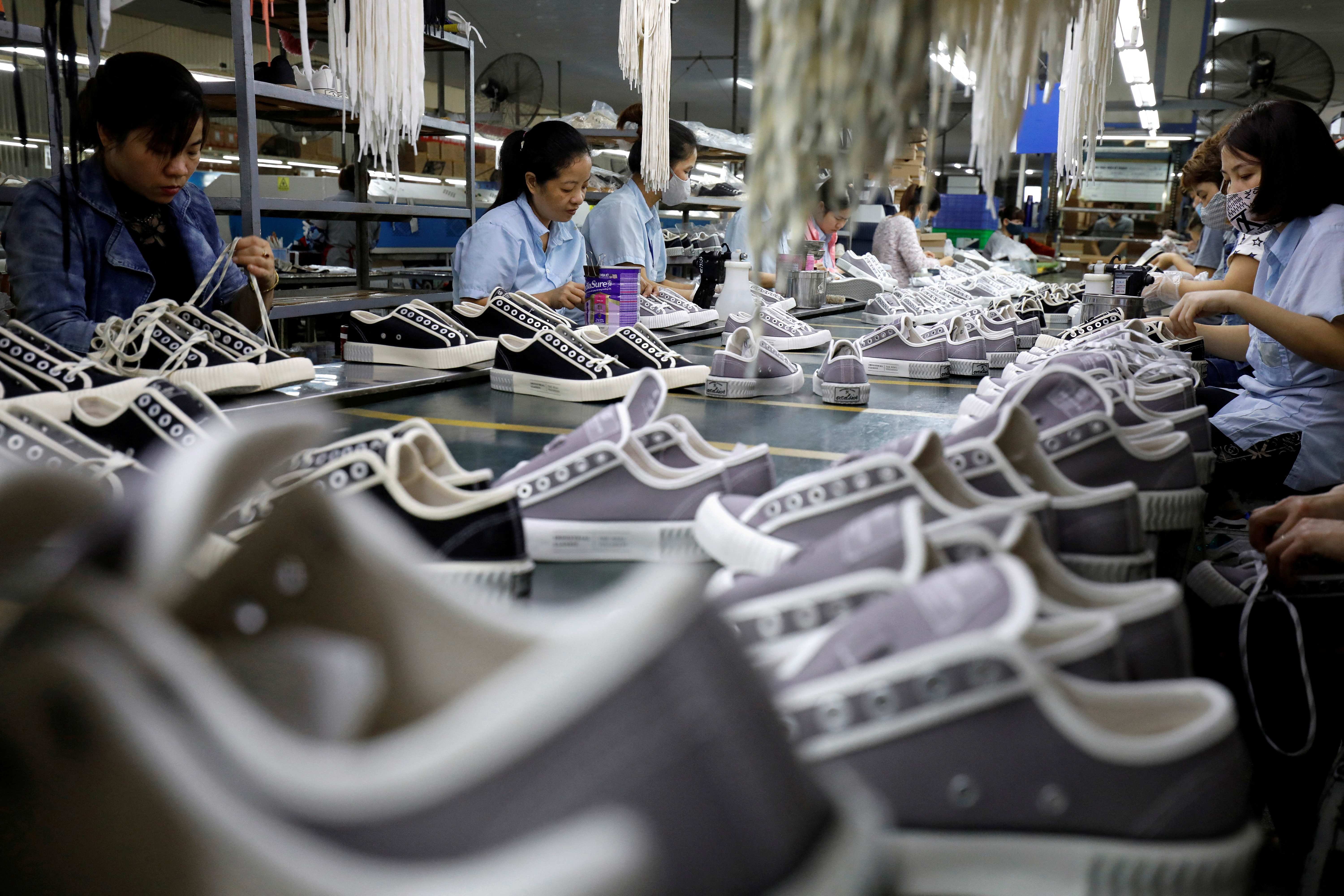 The making of shoes for export at a factory in Hanoi
