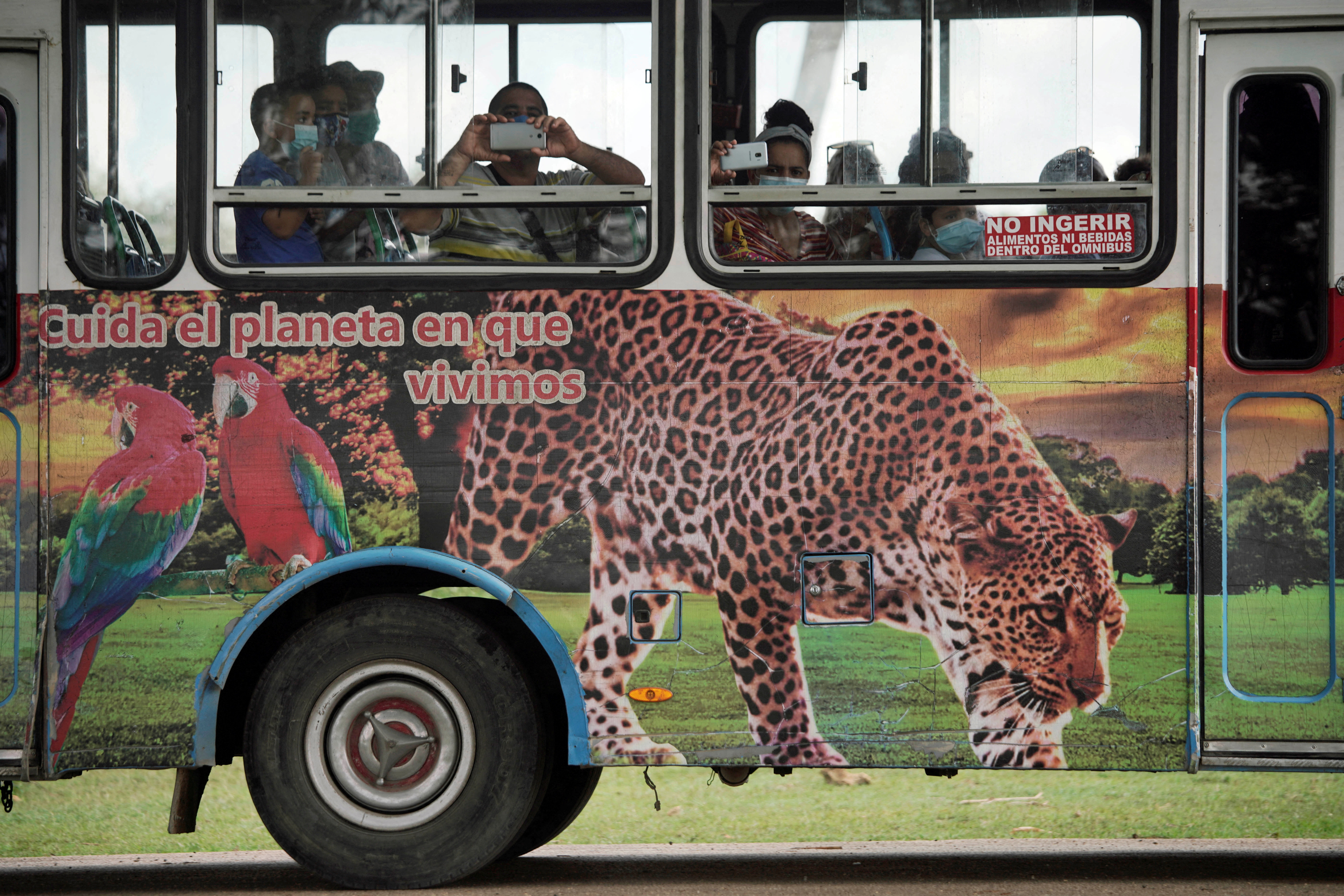 Visitors take pictures at the zoo in Havana