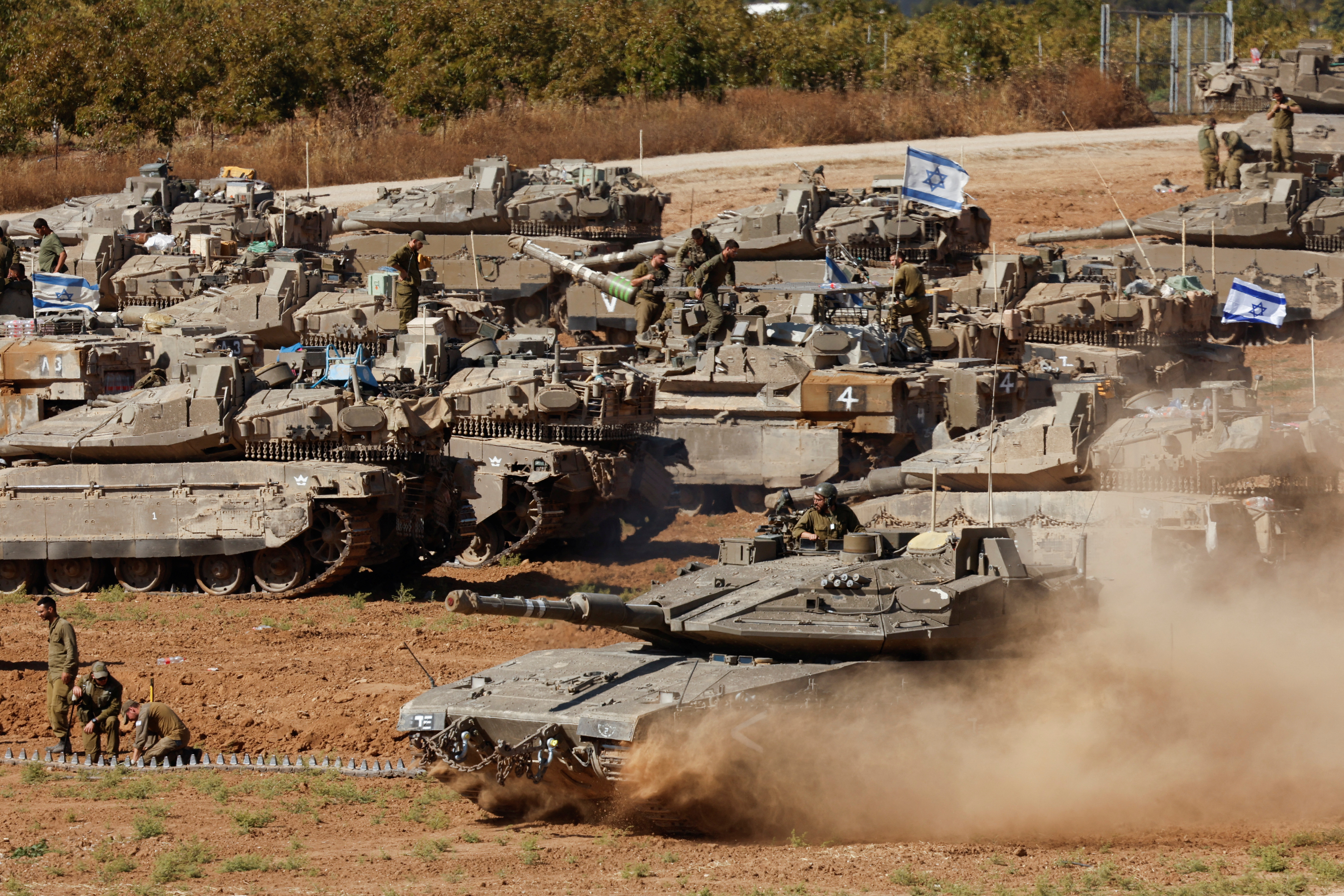 An Israeli tank maneuvers, amid the ongoing conflict between Israel and the Palestinian Islamist group Hamas, near the Israel-Gaza Border, in southern Israel