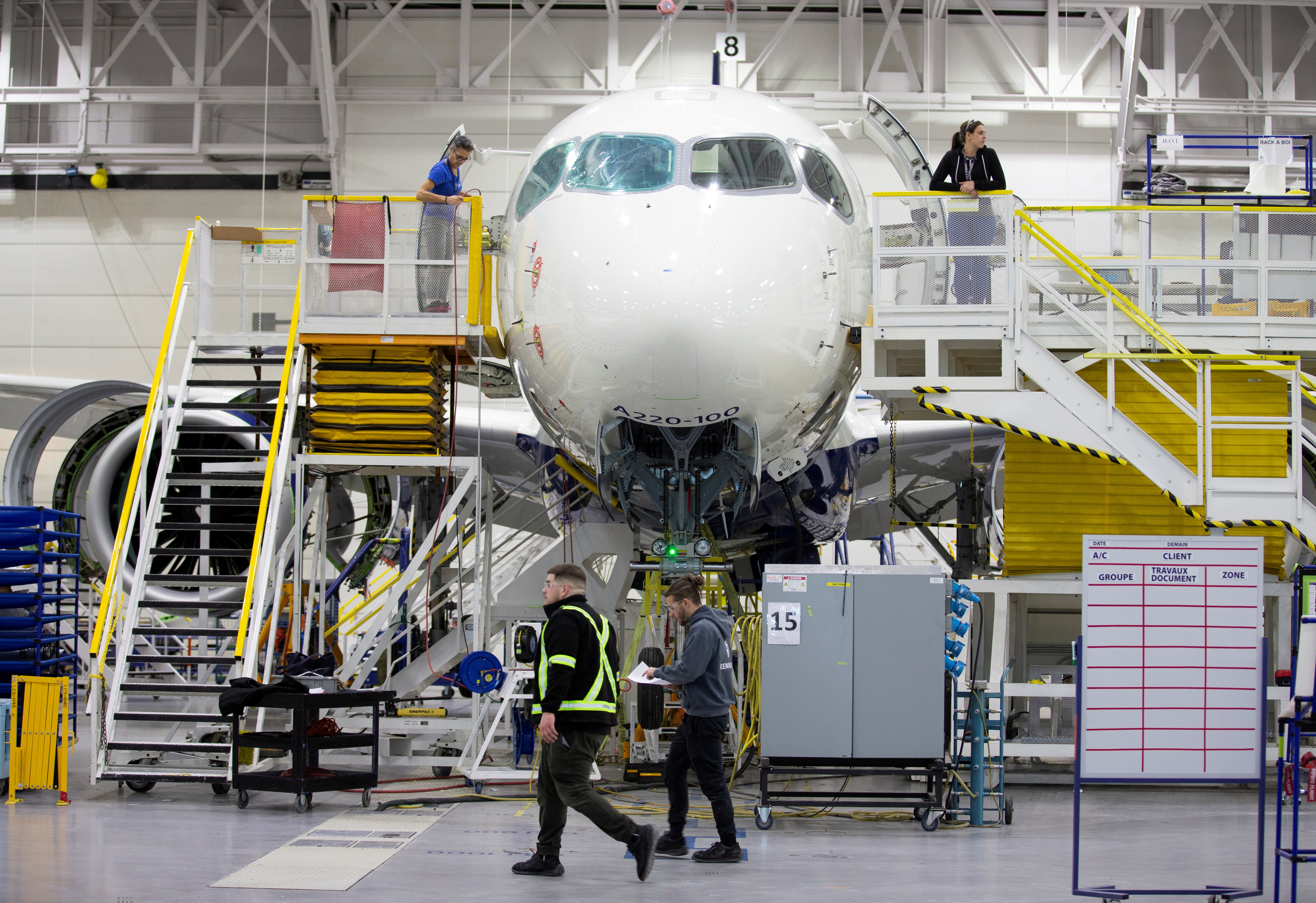 Employees work on an Airbus A220-300 at the Airbus facility in Mirabel, Quebec, Canada February 20, 2020. REUTERS/Christinne Muschi