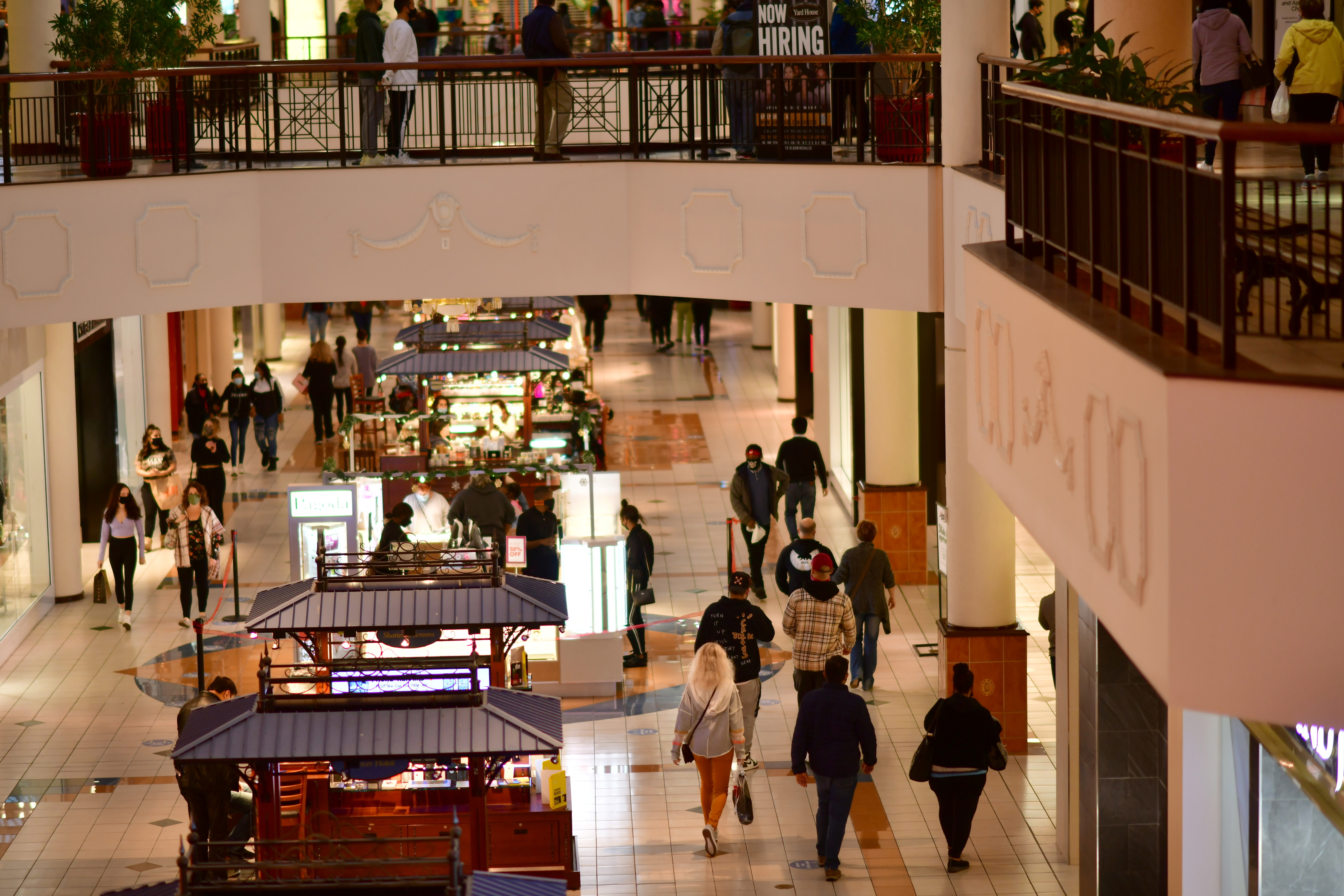 Shoppers carry bags of purchased merchandise at the Willow Grove Park Mall in Willow Grove