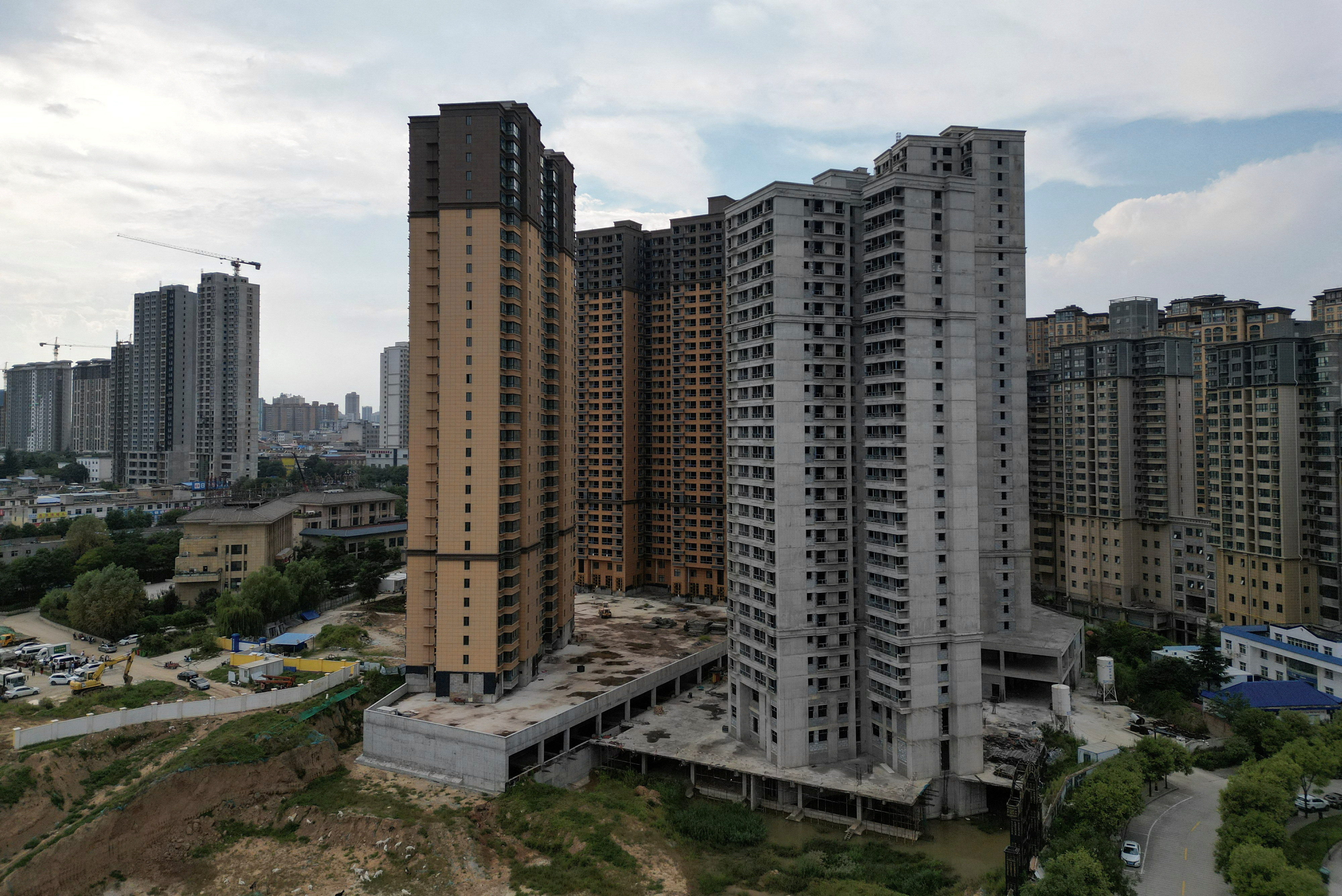 Aerial view shows unfinished residential buildings of the Gaotie Wellness City complex in Tongchuan