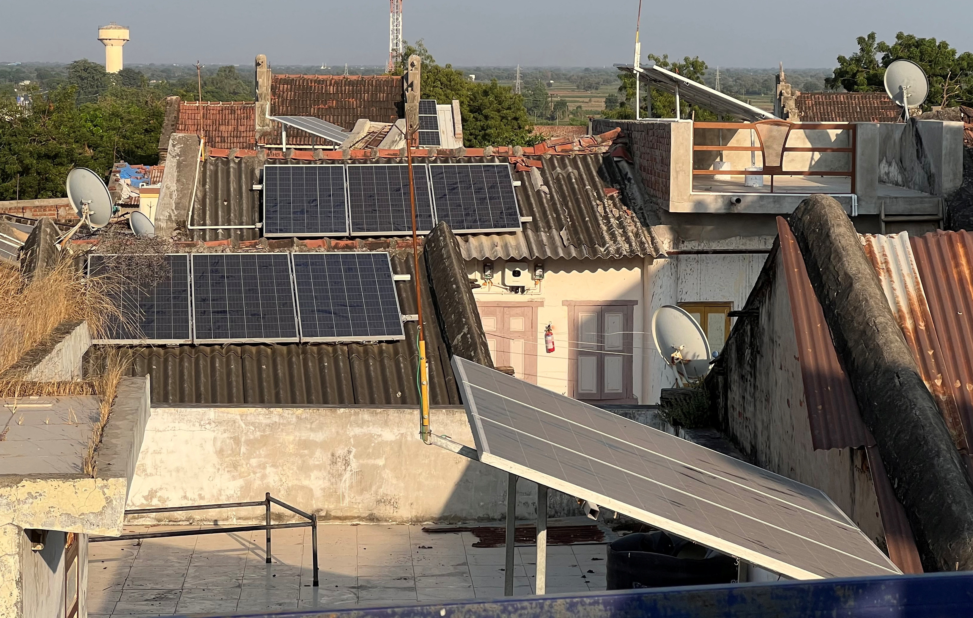 Solar panels are installed on the rooftops of residential houses in Modhera