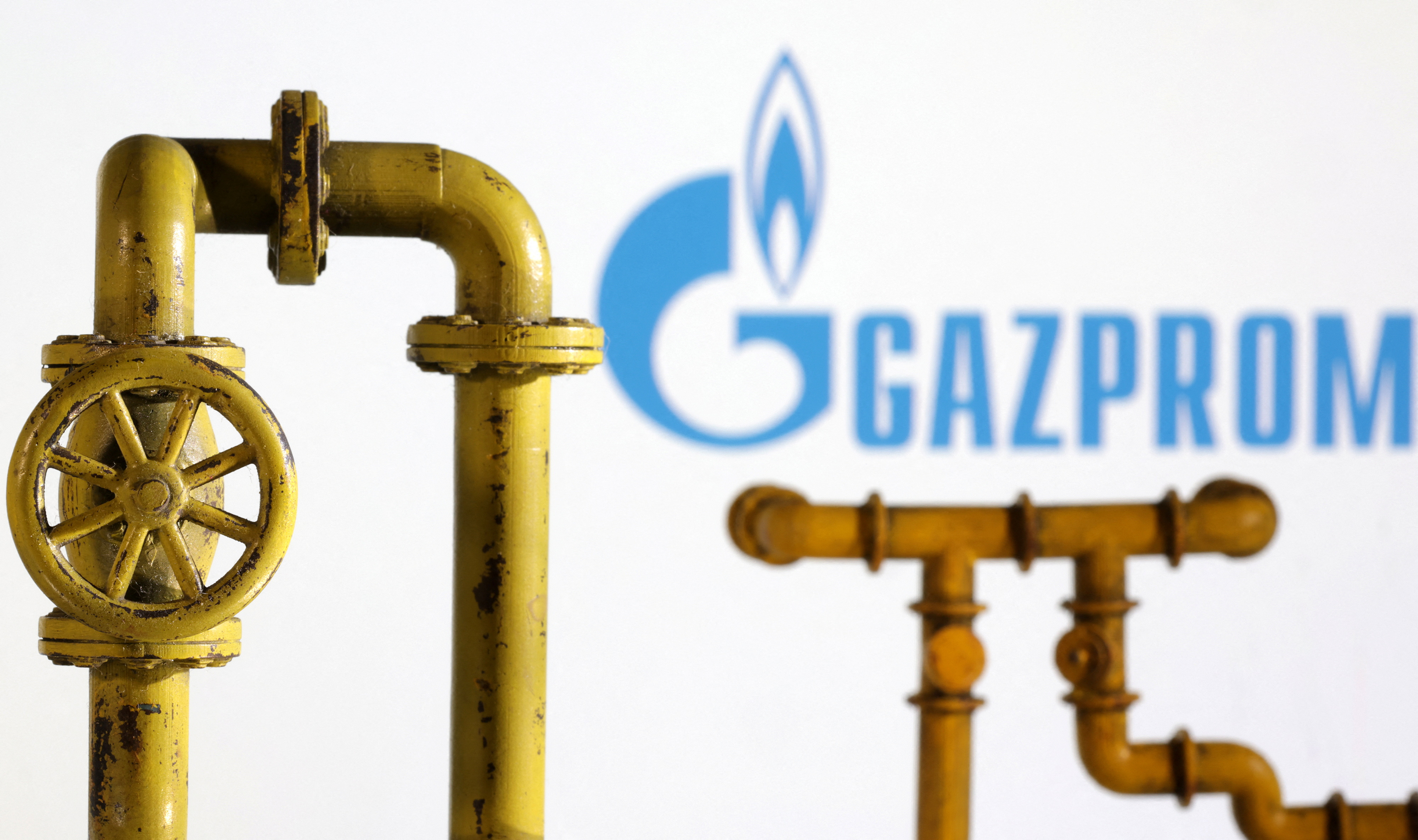 Illustration shows natural gas pipeline and Gazprom logo