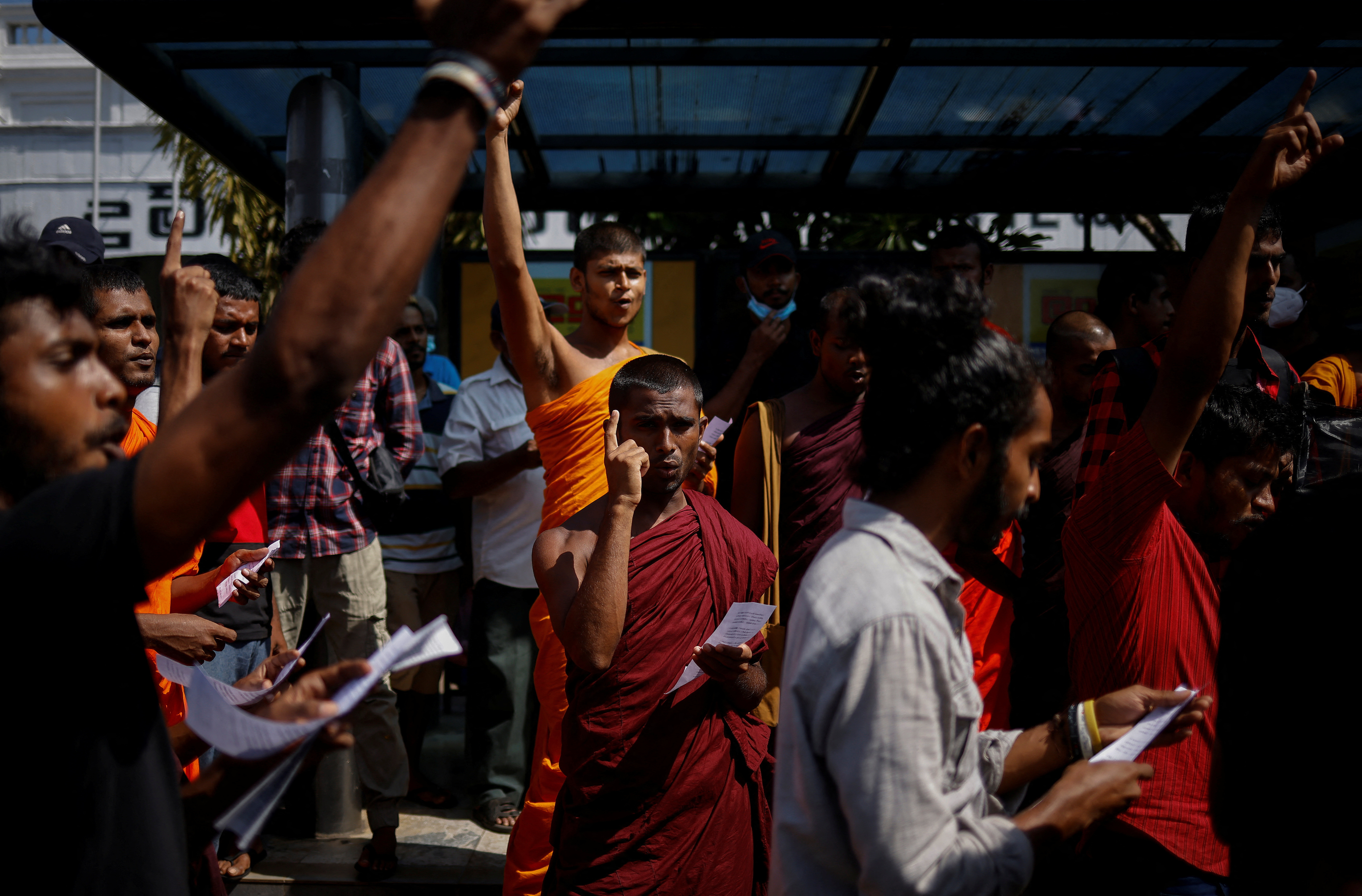 Protestors shout slogans during a protest demanding the resignation of Sri Lanka's acting President Ranil Wickremesinghe, in Colombo