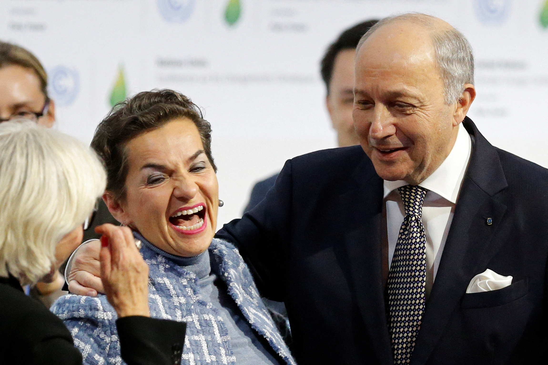 French Foreign Affairs Minister Laurent Fabius, President-designate of COP21, and Christiana Figueres react at the World Climate Change Conference 2015 (COP21) at Le Bourget