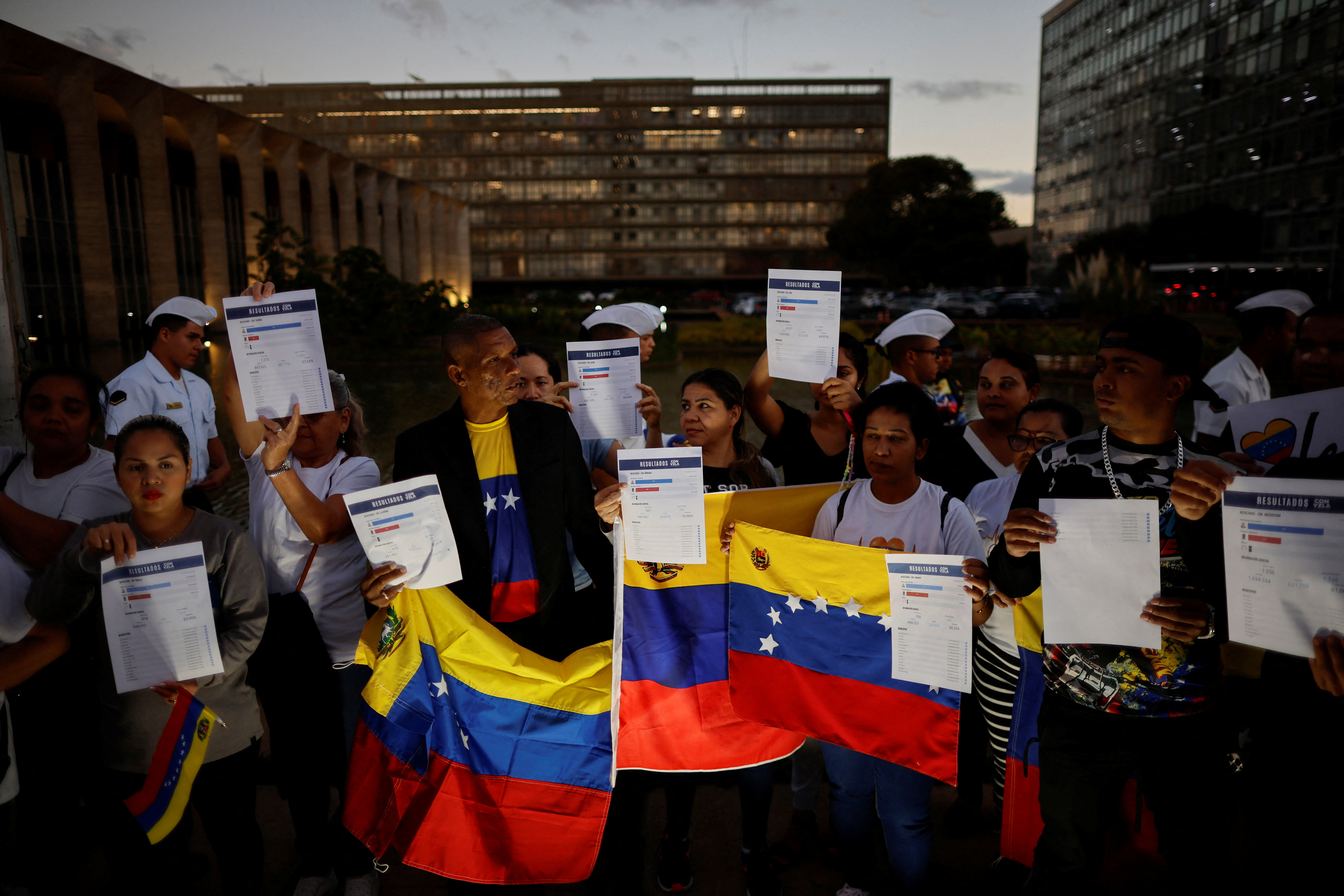 Venezuelan citizens take part in a protest against the electoral results that awarded Venezuela's President Nicolas Maduro, in Brasilia