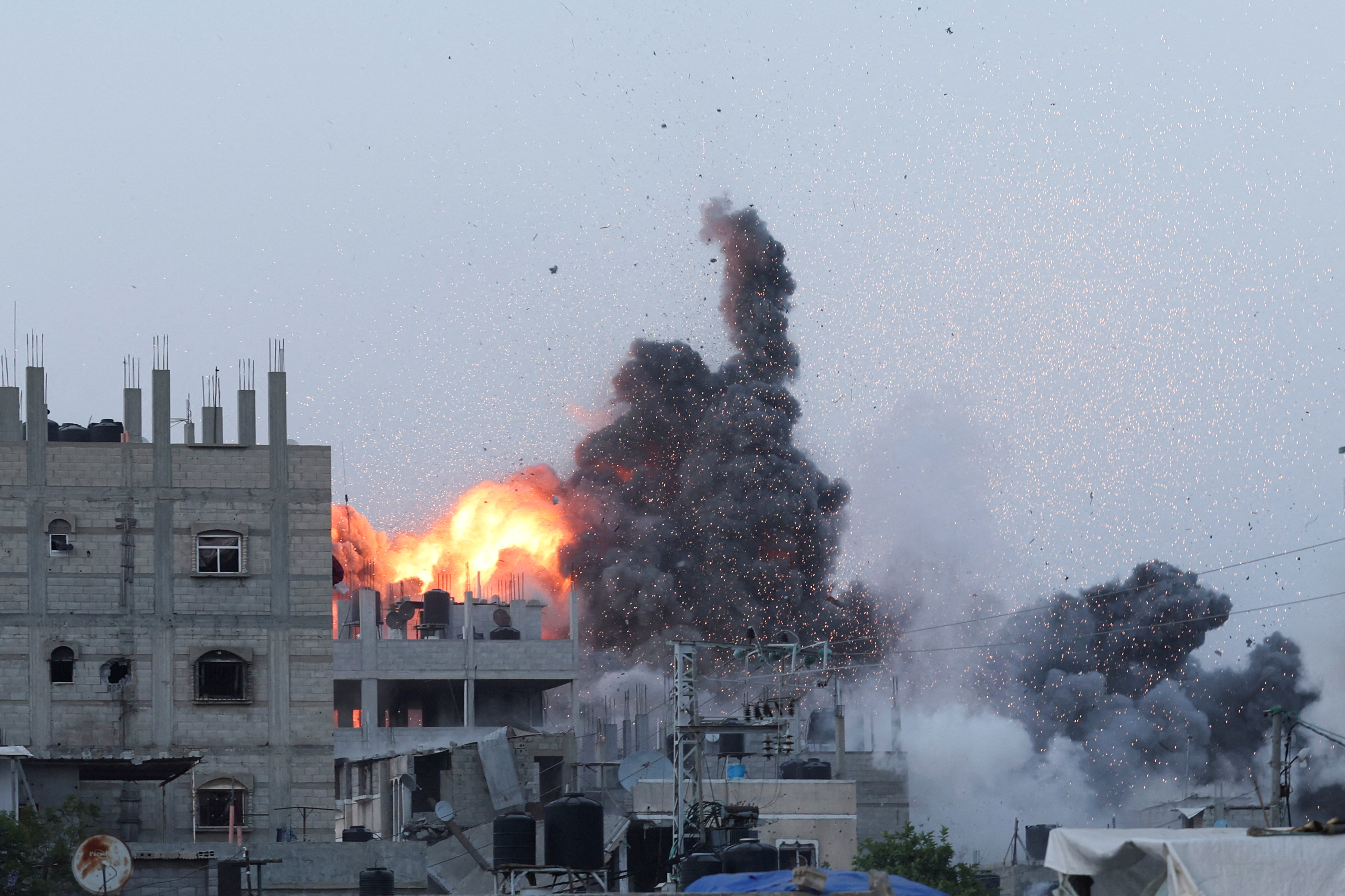 Smoke and flames rise during an Israeli air strike in central Gaza Strip