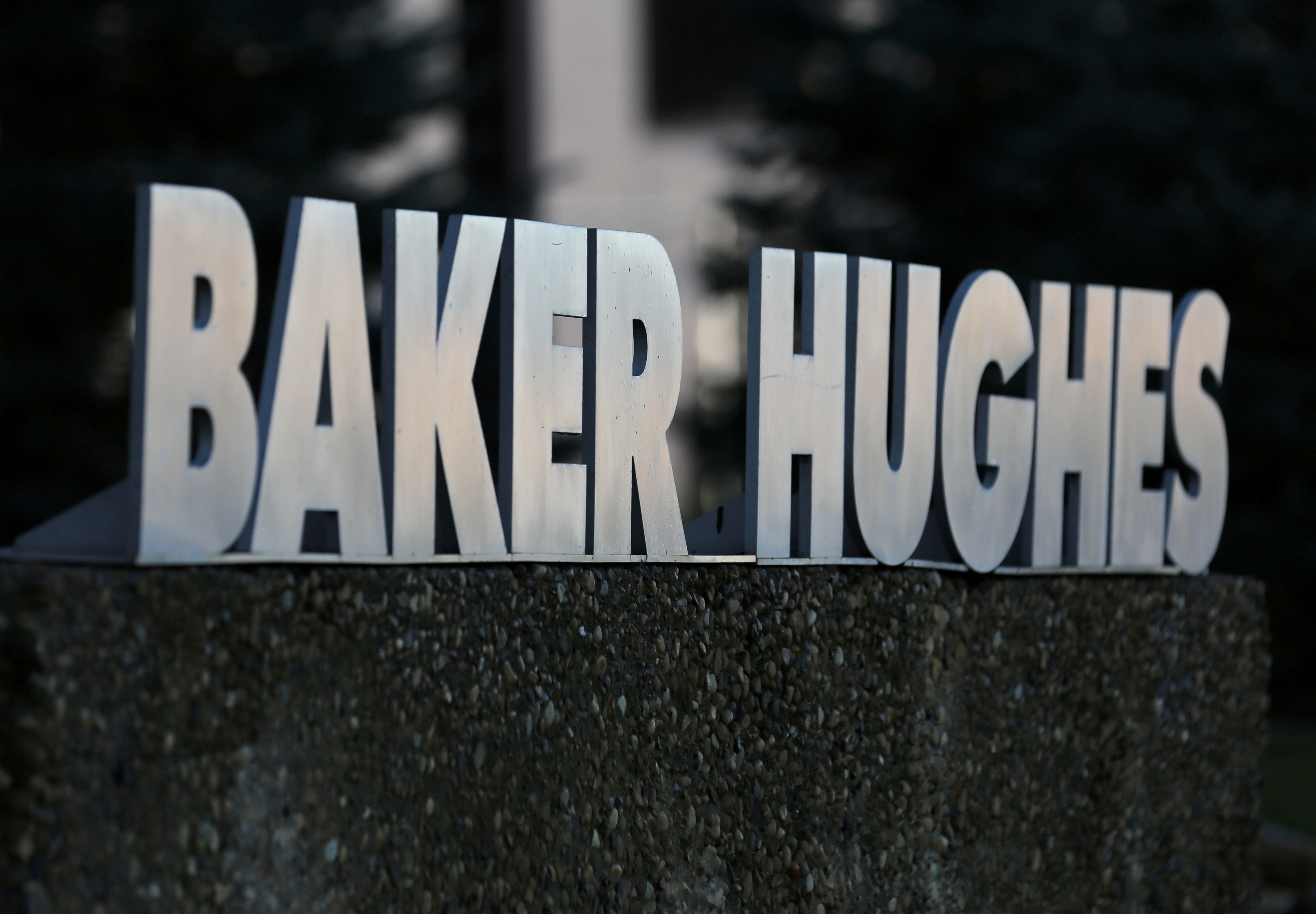 A Baker Hughes sign is displayed outside the oil logistics company's local office in Sherwood Park, near Edmonton, Alberta, Canada November 13, 2016. REUTERS/Chris Helgren 