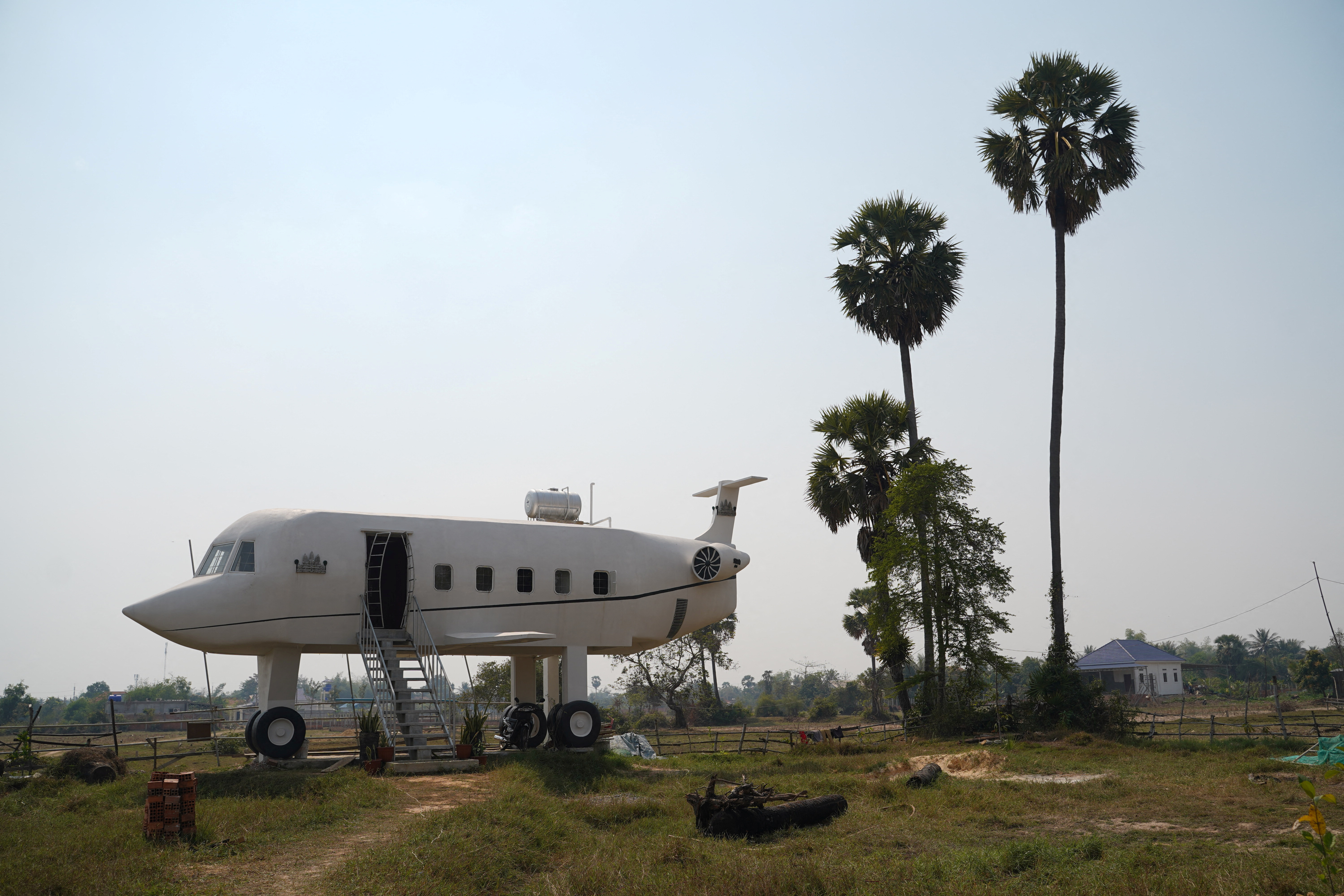 Cambodian man fullfills unfinished dream of flying with airplane house