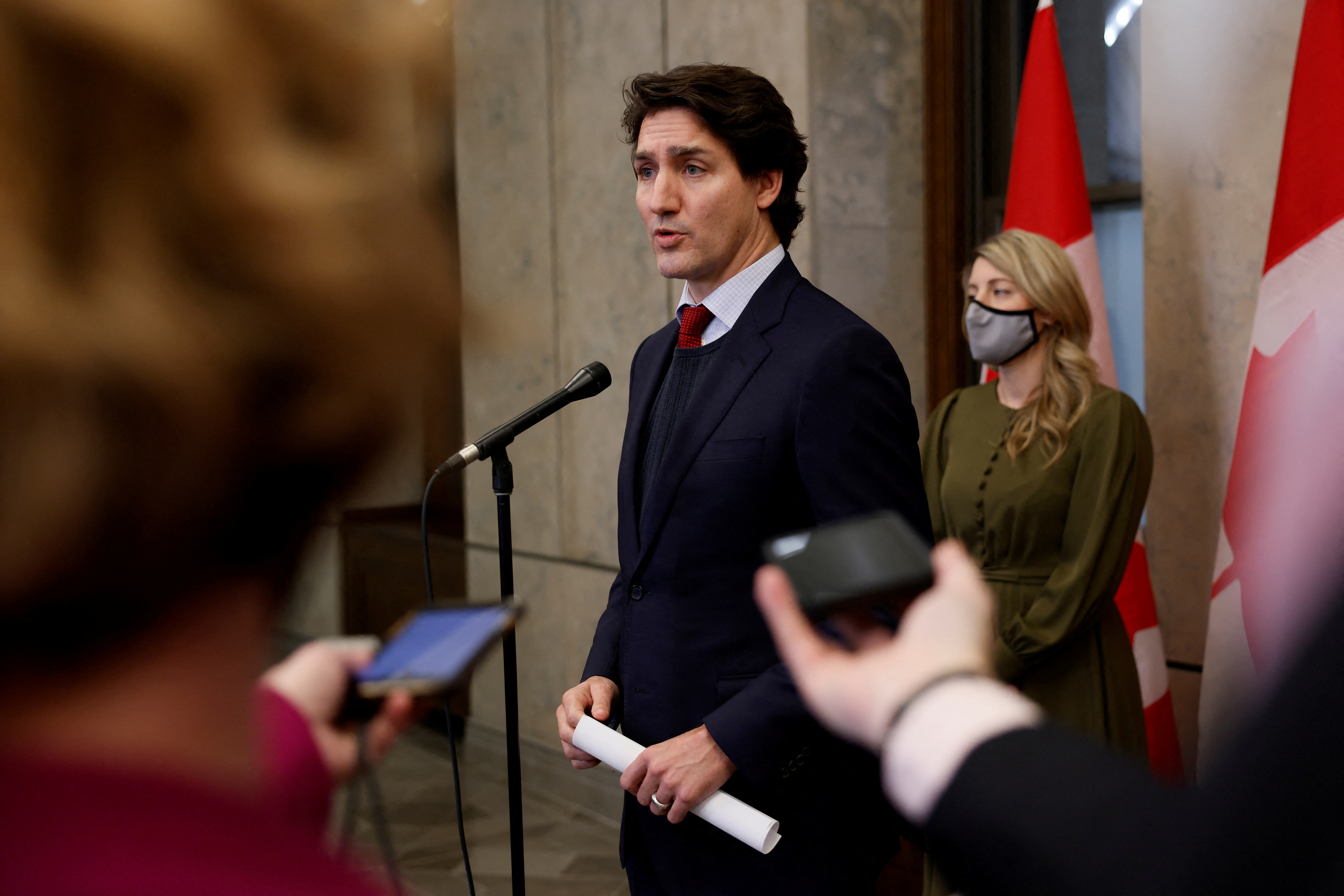 Canada's Prime Minister Justin Trudeau, with Minister of Foreign Affairs Melanie Joly, speaks during a press conference on Parliament Hill in Ottawa