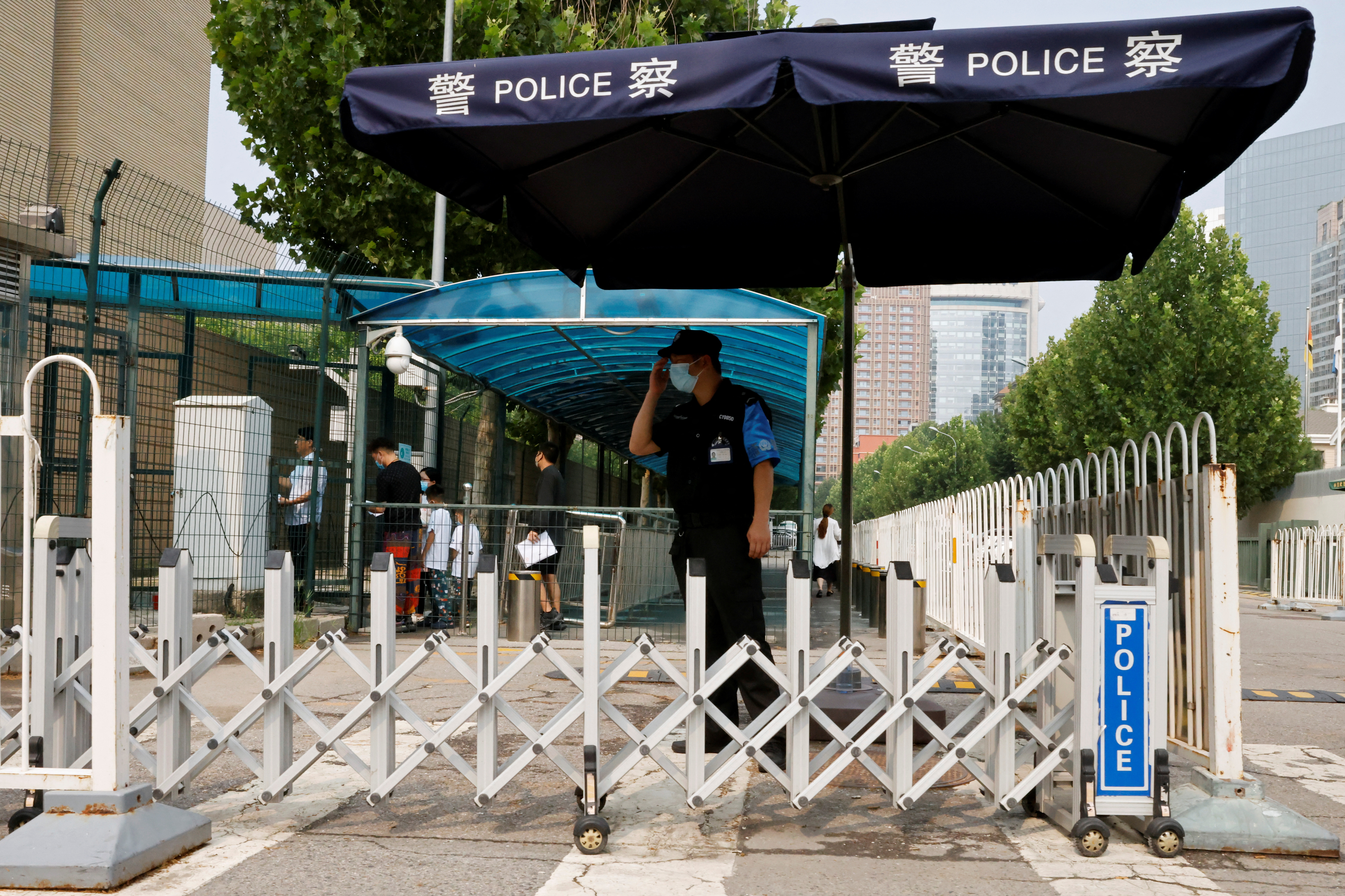 A police officer keeps watch outside the U.S. embassy in Beijing