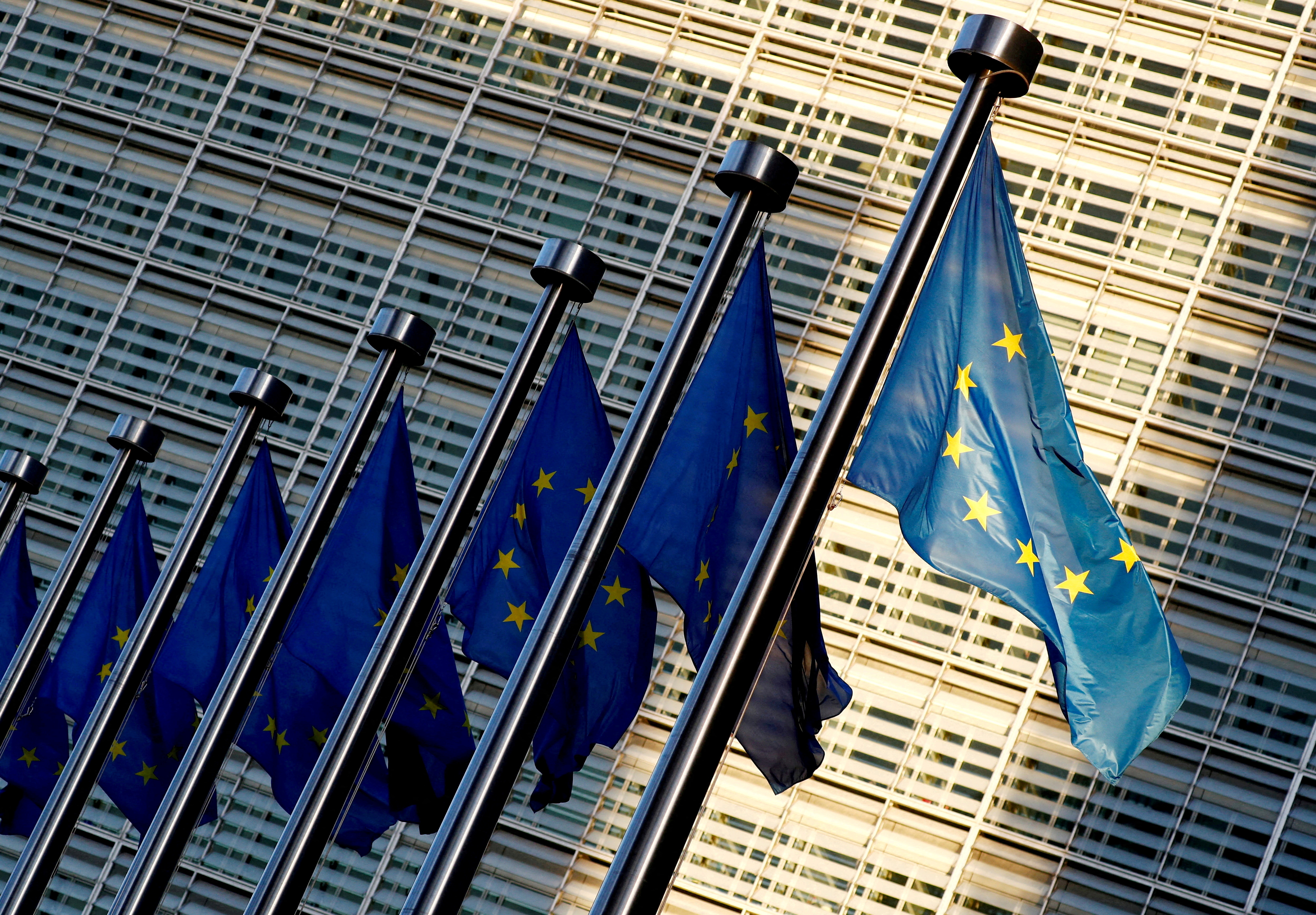 EU flags are seen outside the European Commission headquarters in Brussels