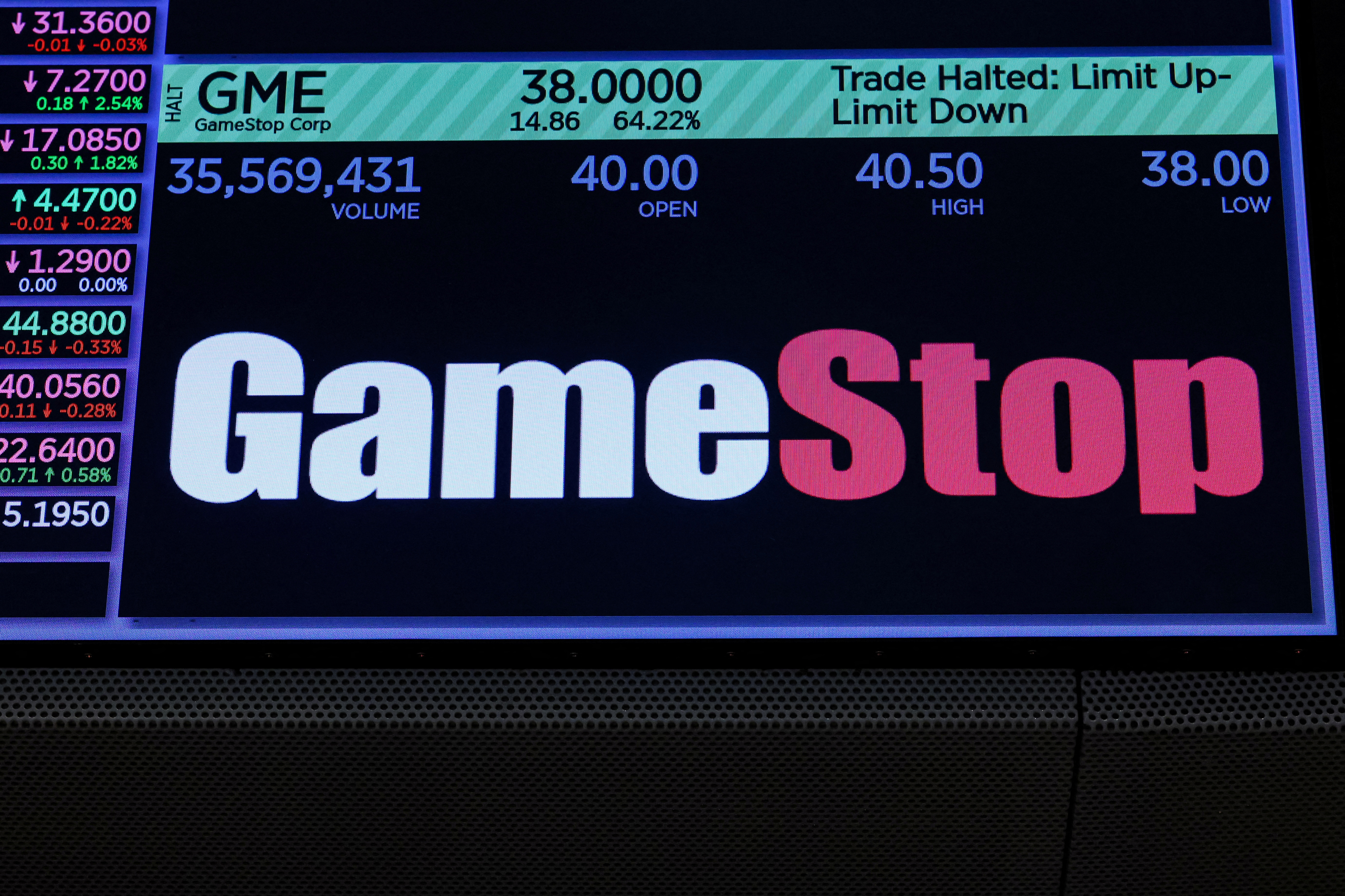 A screen displays GameStop stock trading information on the floor of the NYSE in New York