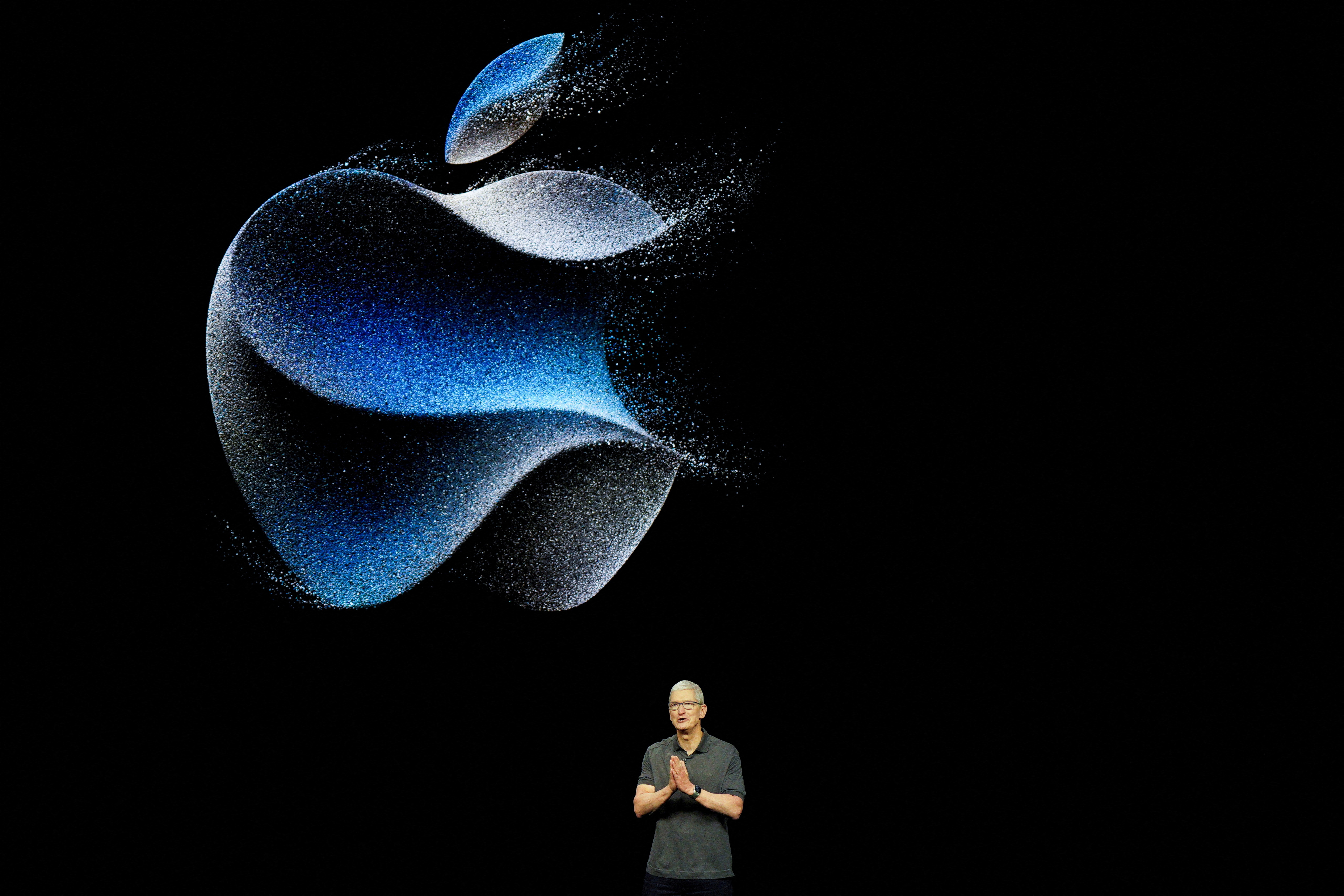 Apple's CEO, Tim Cook, is shown at a company event in Cupertino