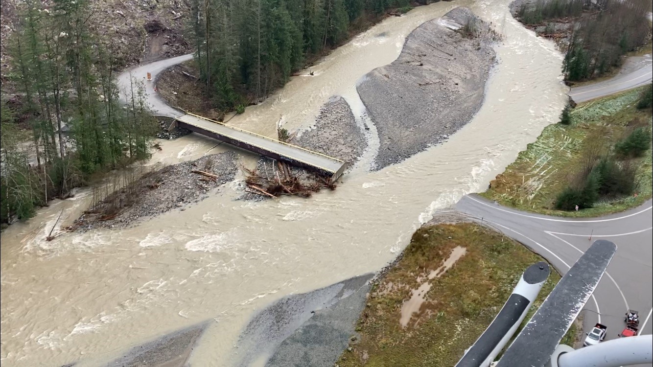 A swollen creek flows under a washed out bridge at the Carolin Mine interchange with Coquihalla Highway 5 after devastating rain storms caused flooding and landslides, near Hope, British Columbia, Canada November 17, 2021. Picture taken November 17, 2021. B.C. Ministry of Transportation and Infrastructure/Handout via REUTERS.  NO RESALES. NO ARCHIVES. THIS IMAGE HAS BEEN SUPPLIED BY A THIRD PARTY.