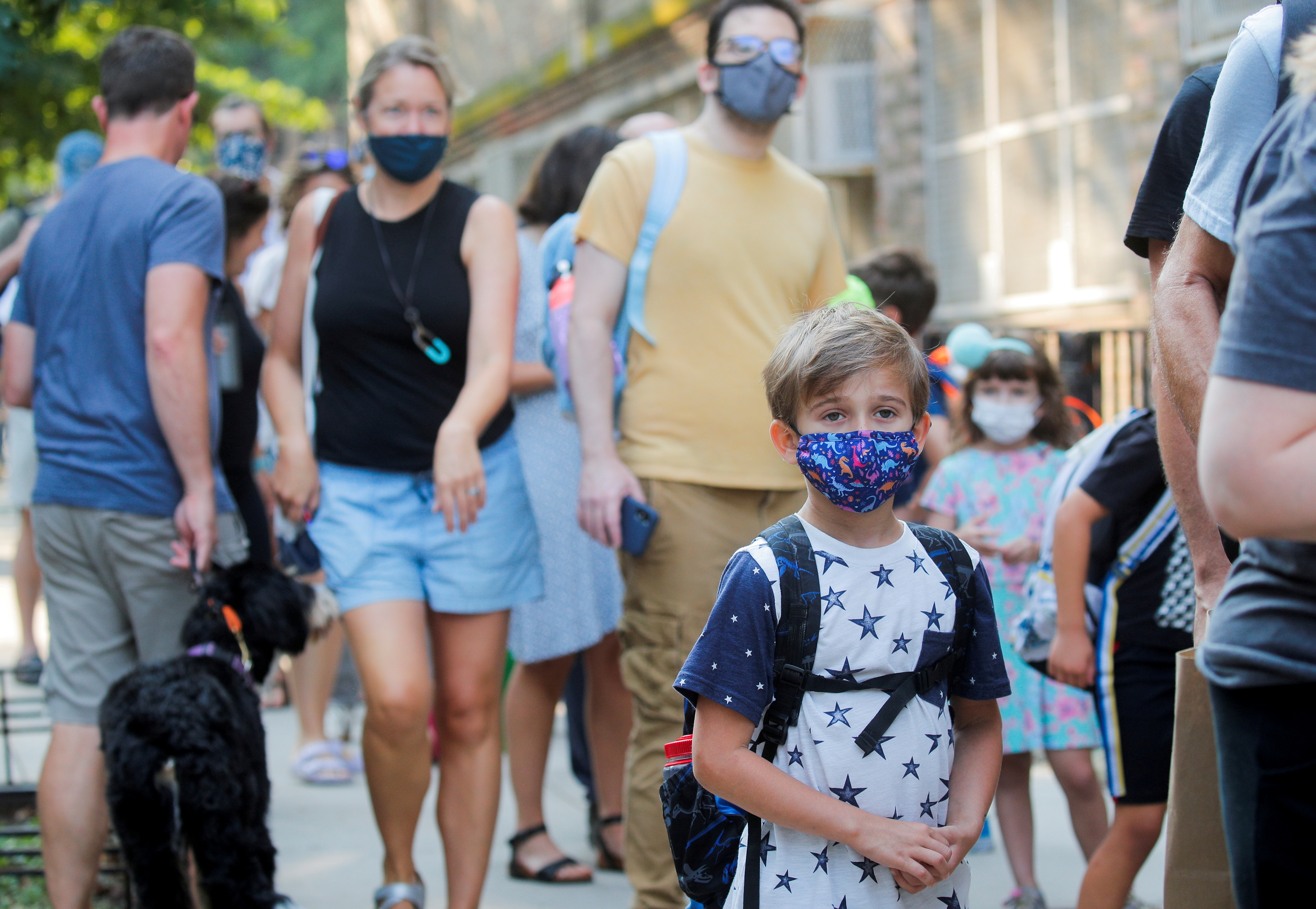 A child wears a face mask on the first day of New York City schools, amid the coronavirus disease (COVID-19) pandemic in Brooklyn, New York, U.S. September 13, 2021. REUTERS/Brendan McDermid