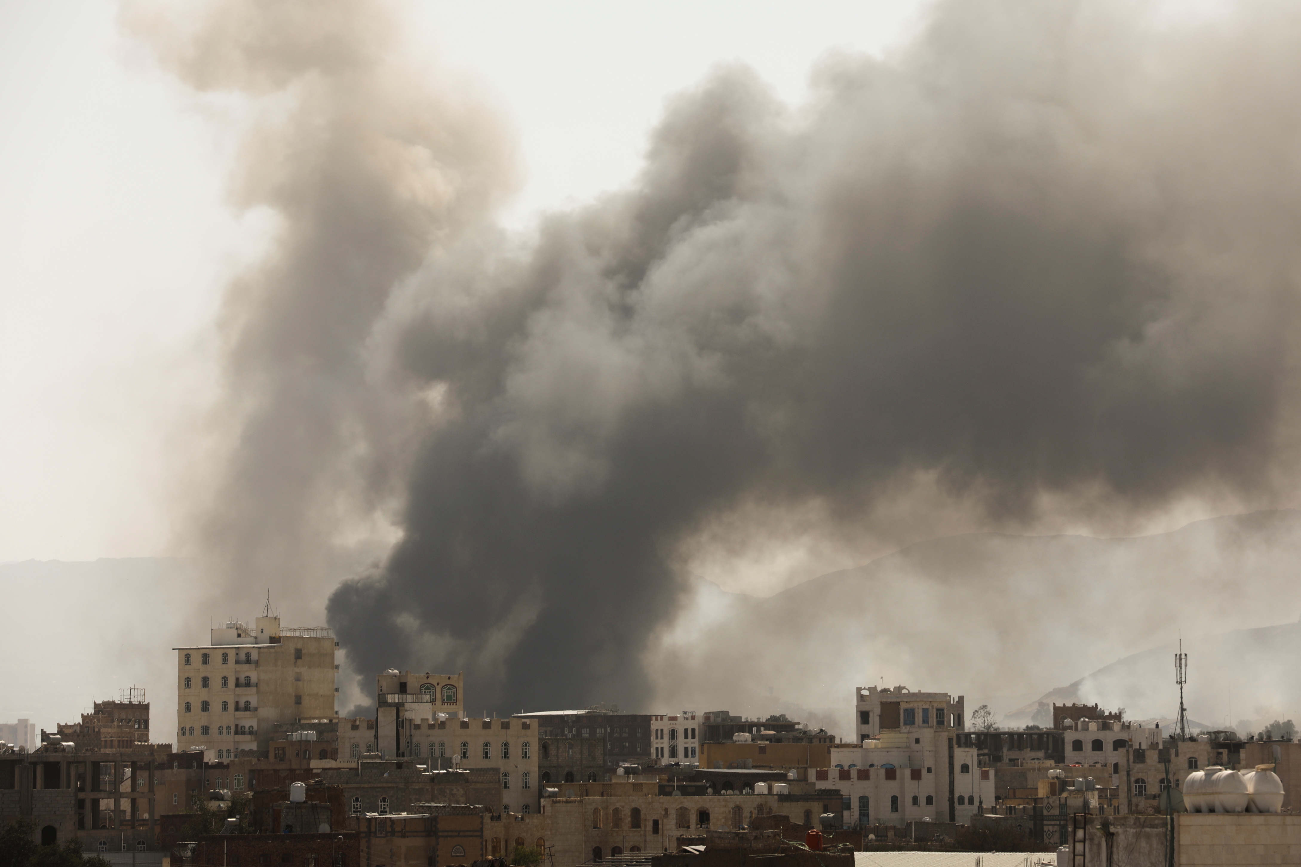 Smoke billows from the site of Saudi-led air strikes in Sanaa, Yemen