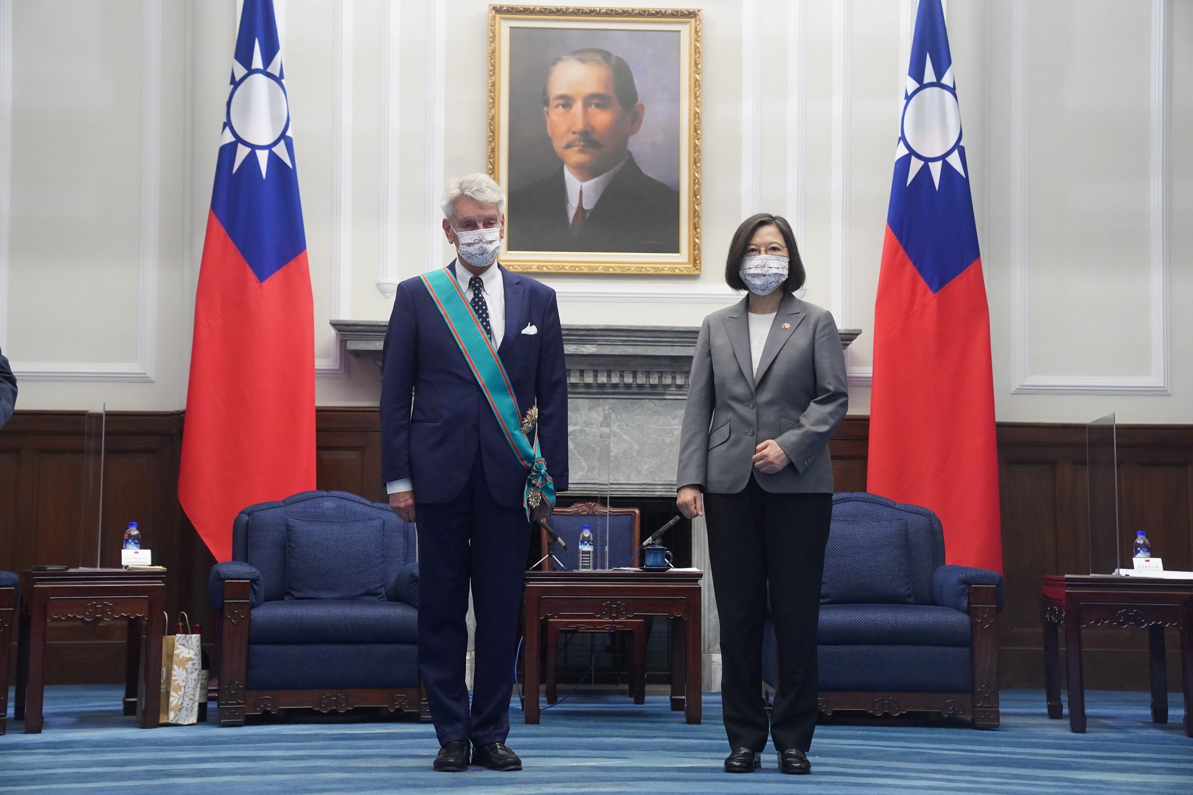 Taiwan's President Tsai Ing-wen stands next to French Senator Alain Richard during their meeting in Taipei