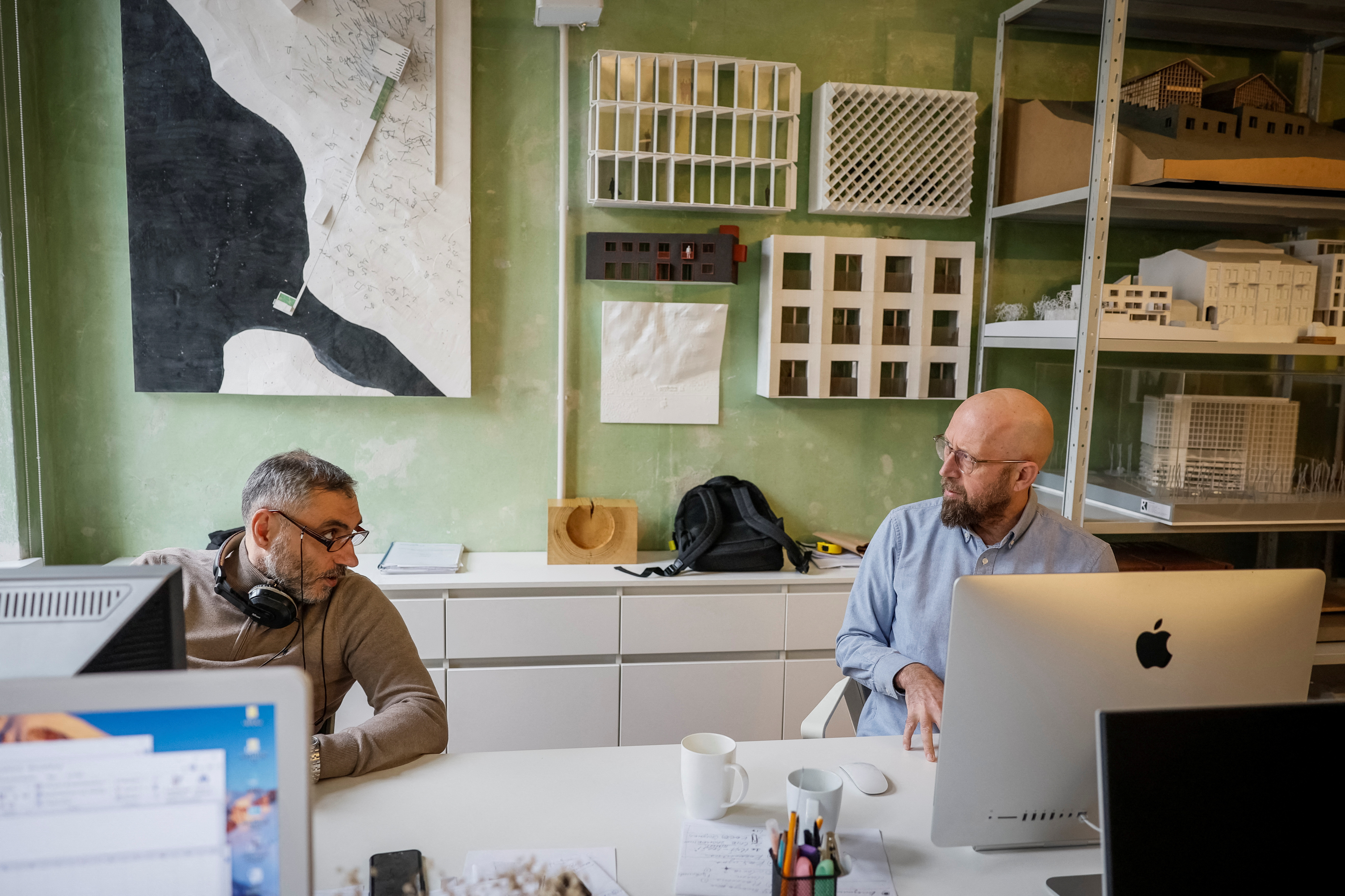 Architects from Kharkiv sit in their reopened office, in Lviv