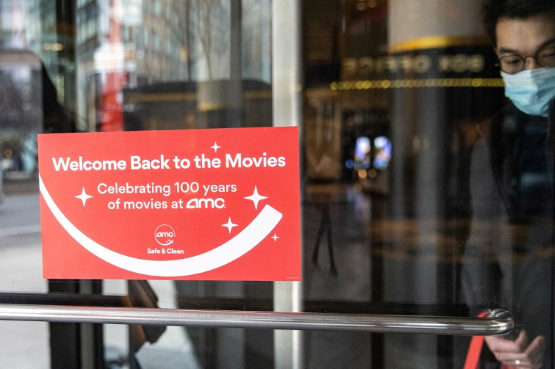 Welcome signage is seen outside the AMC movie theatre in Lincoln Square, amid the coronavirus disease (COVID-19) pandemic, in the Manhattan borough of New York City, New York, U.S., March 6, 2021. REUTERS/Jeenah Moon 
