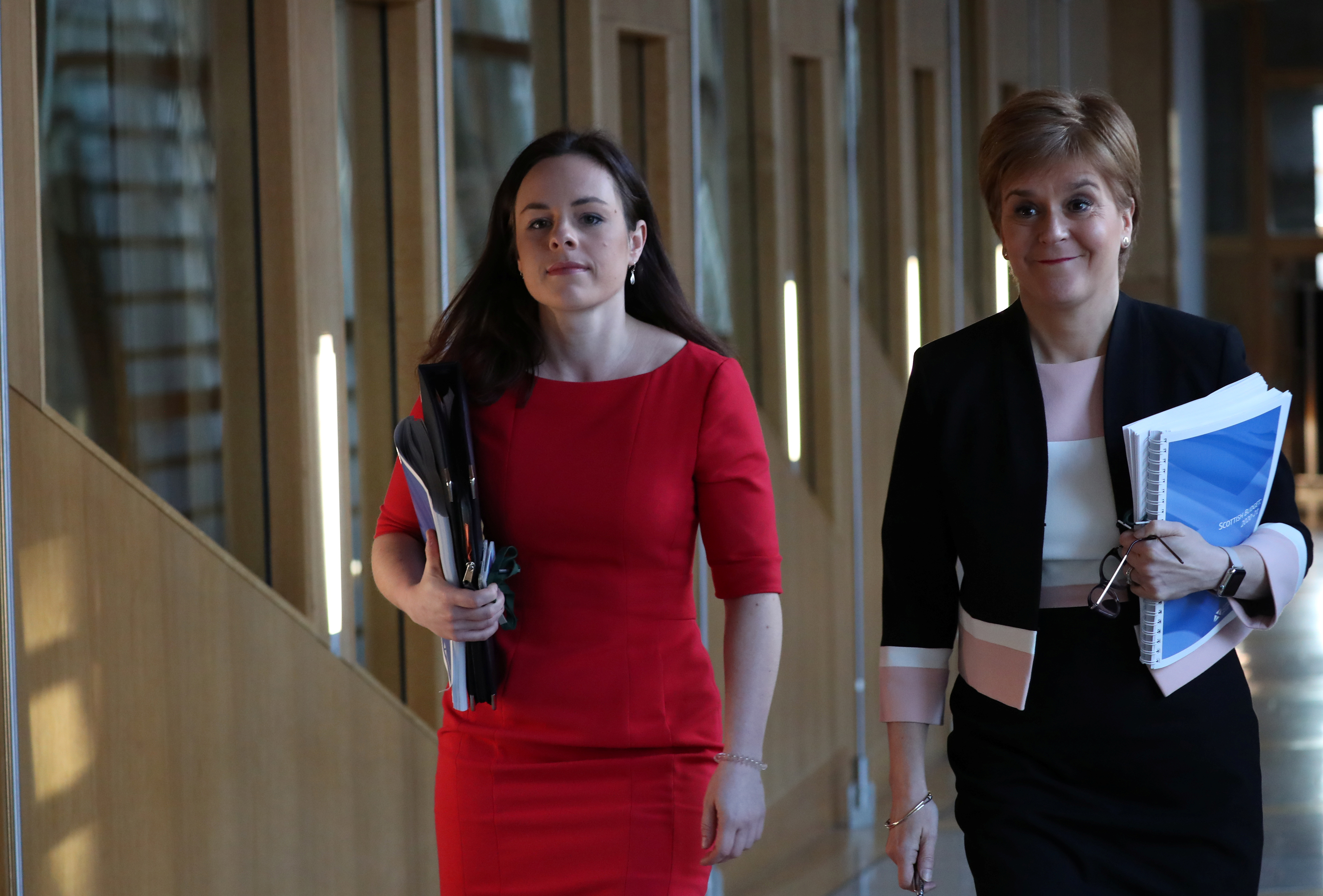 Scotland's First Minister Nicola Sturgeon walks to the chamber with Kate Forbes MSP Minister for Public Finance in Edinburgh