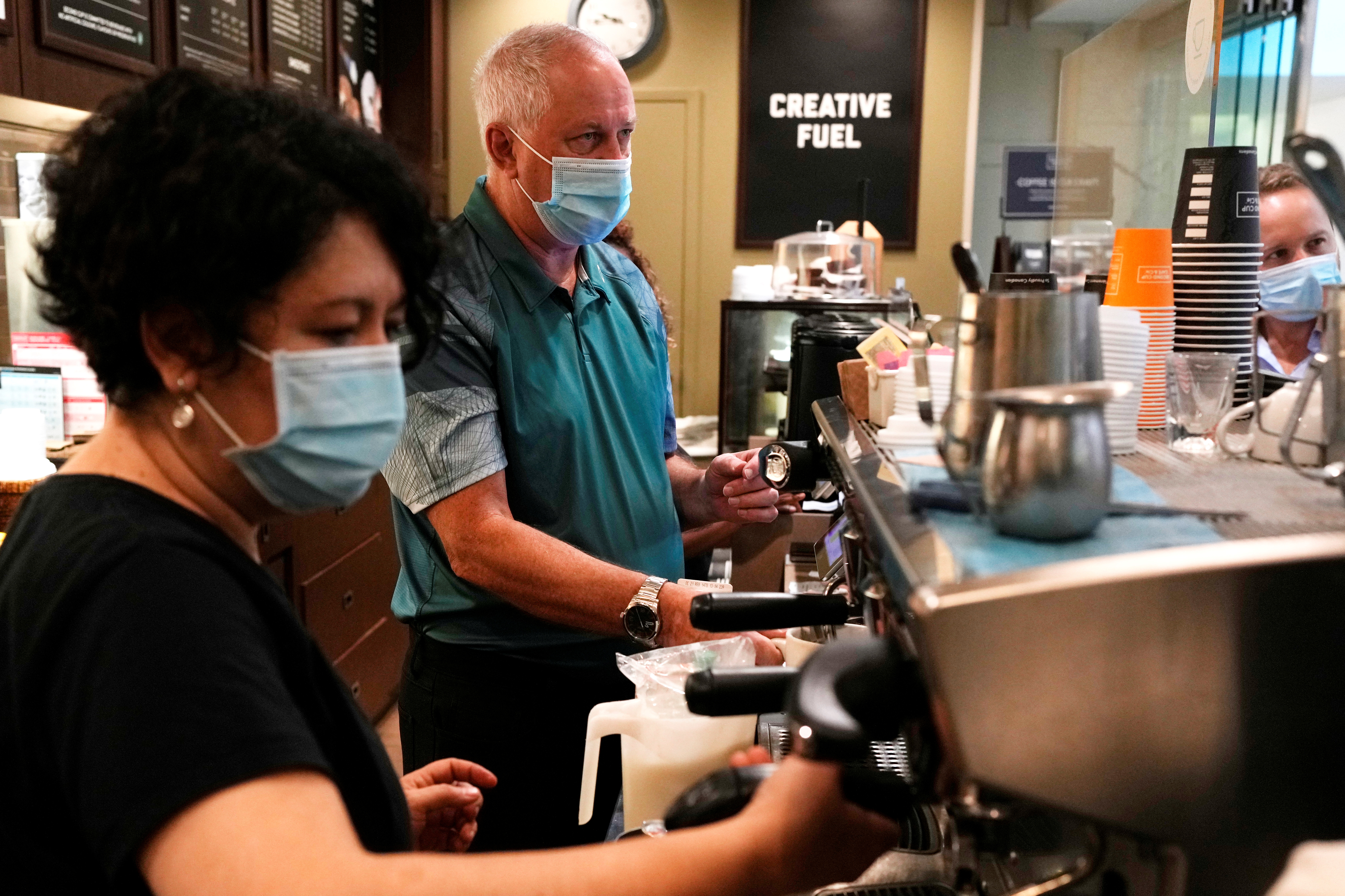 Coffee shop owner works at his franchise in Toronto's PATH