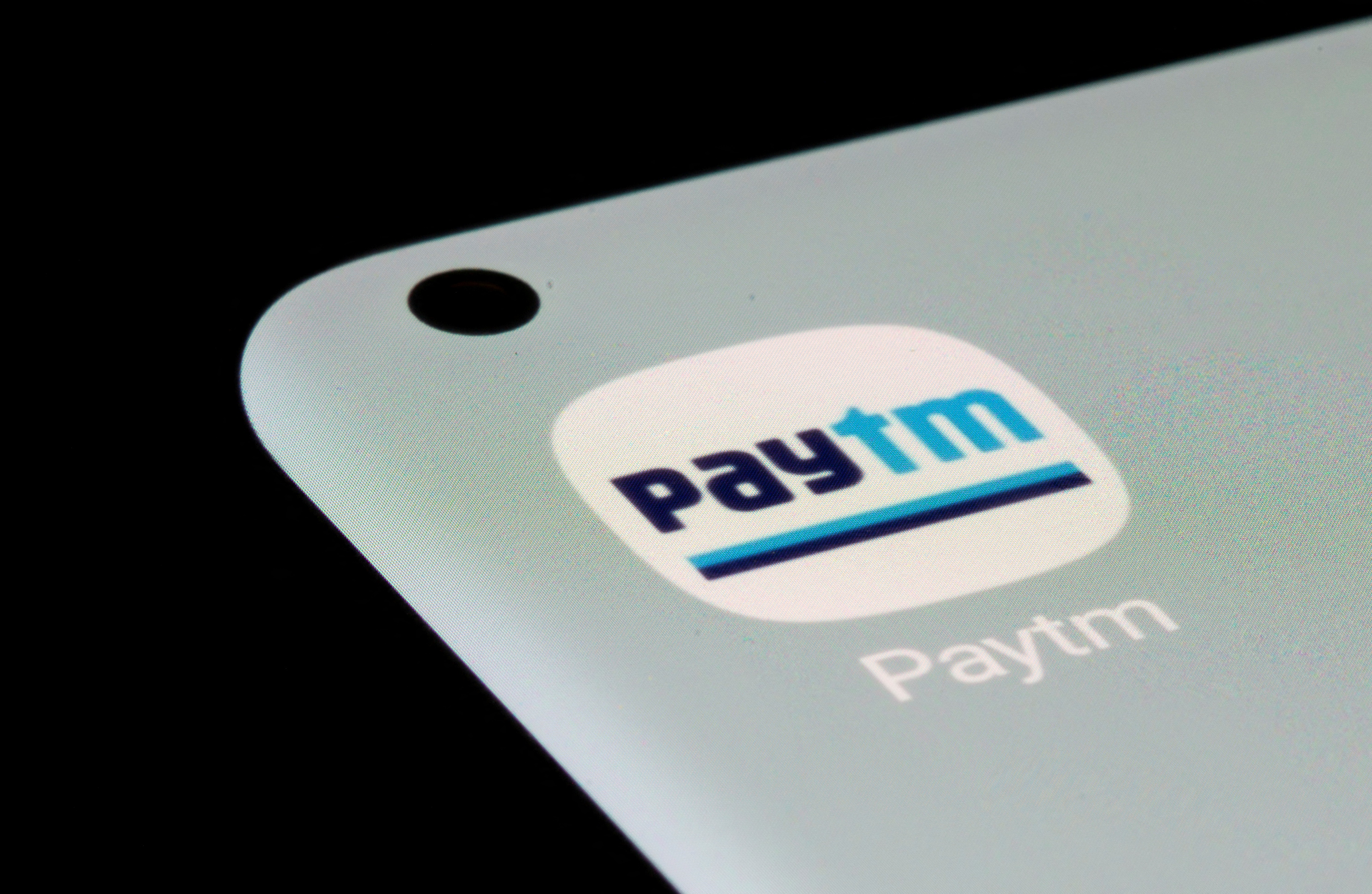 Paytm app is seen on a smartphone in this illustration