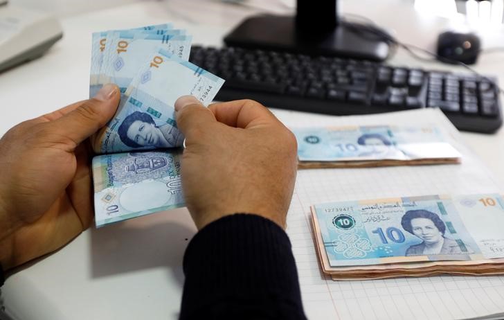 Tunisia s dinar hits new record low versus dollar Reuters