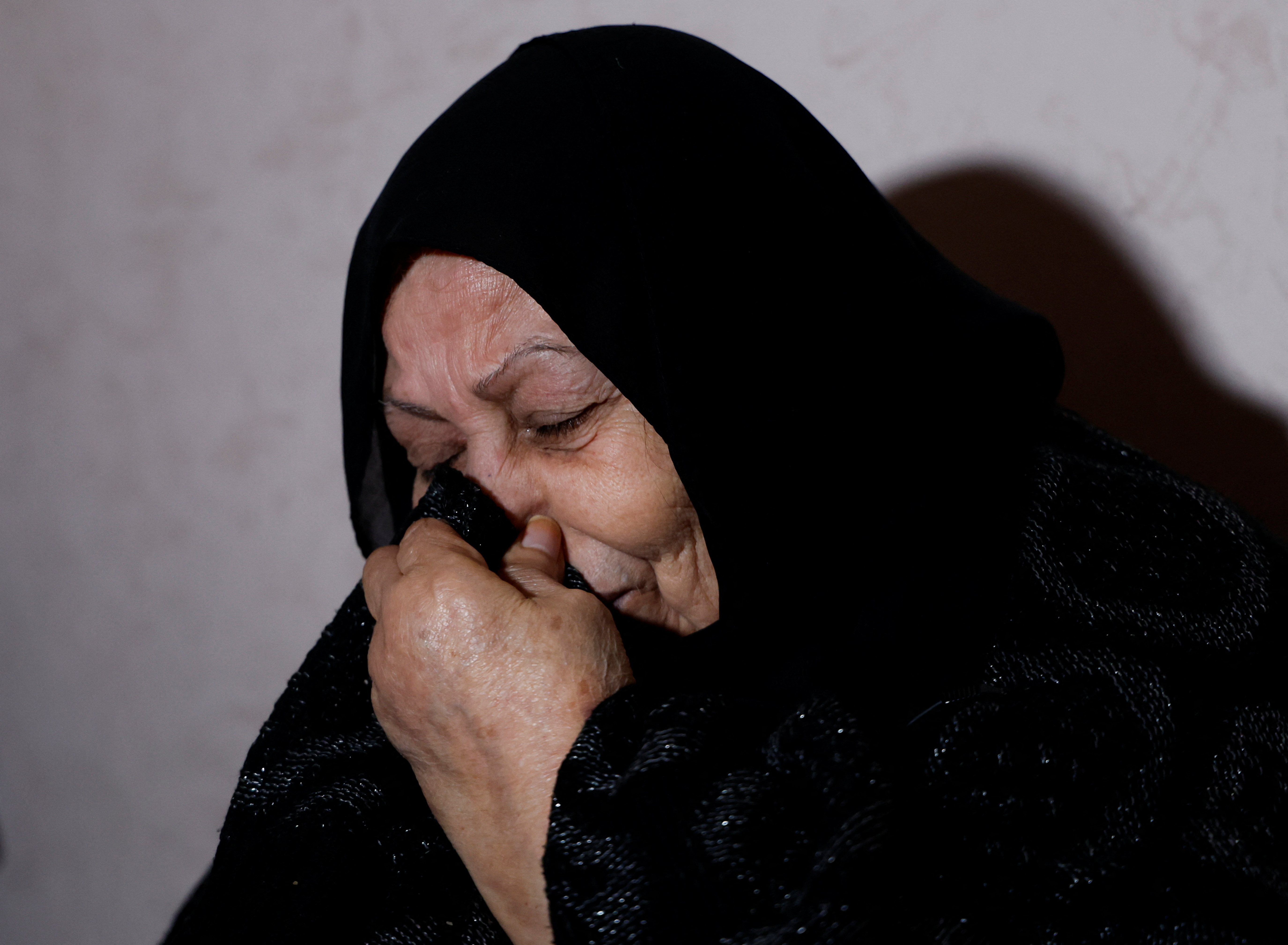 Mother of a Palestinian man, Abdel-Karim Abu Jalhoum, who died with his family in the earthquake in Turkey, mourns at the family house in Beit Lahiya in northern Gaza Strip