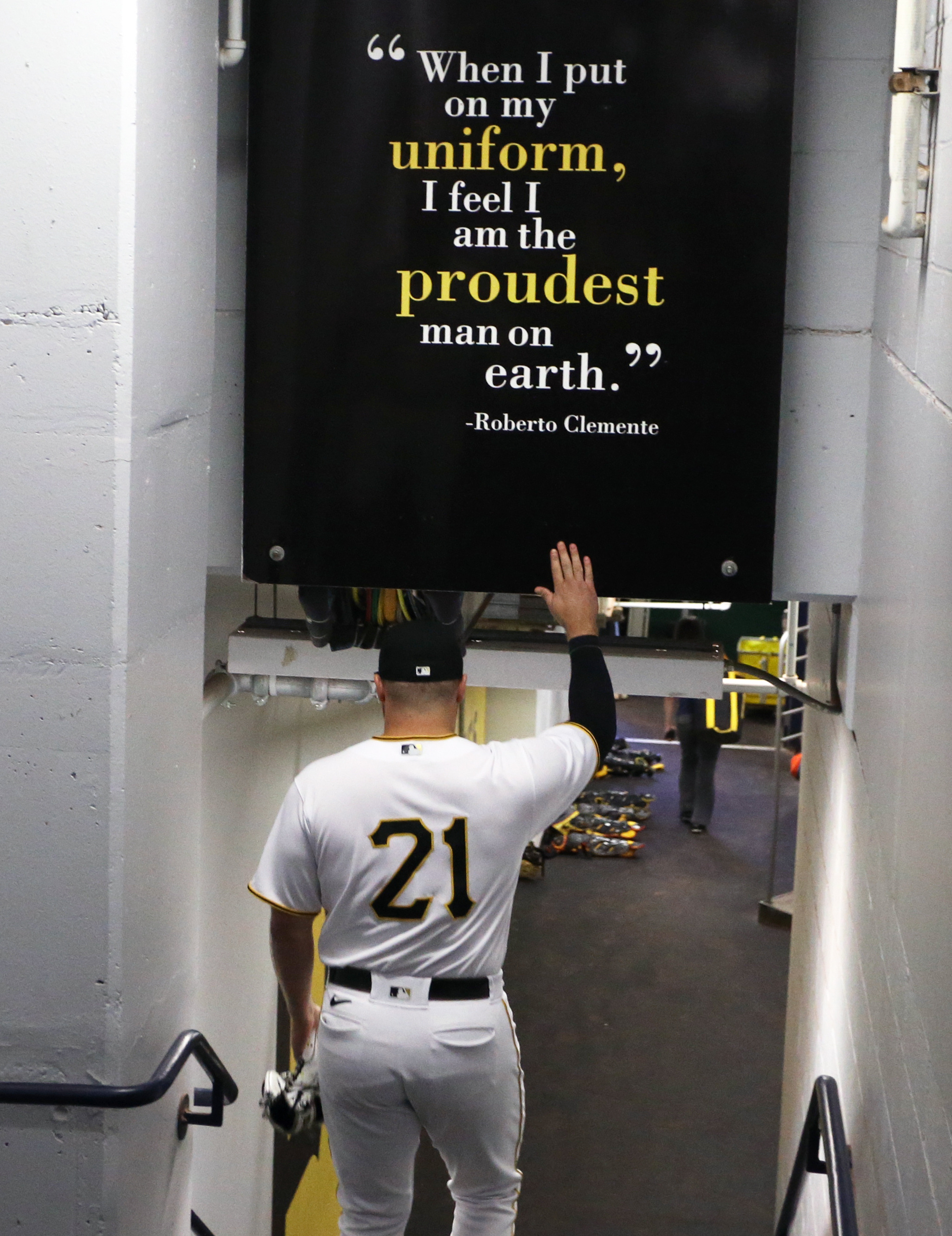 Roberto Clemente quote: When I put on my uniform, I feel I am