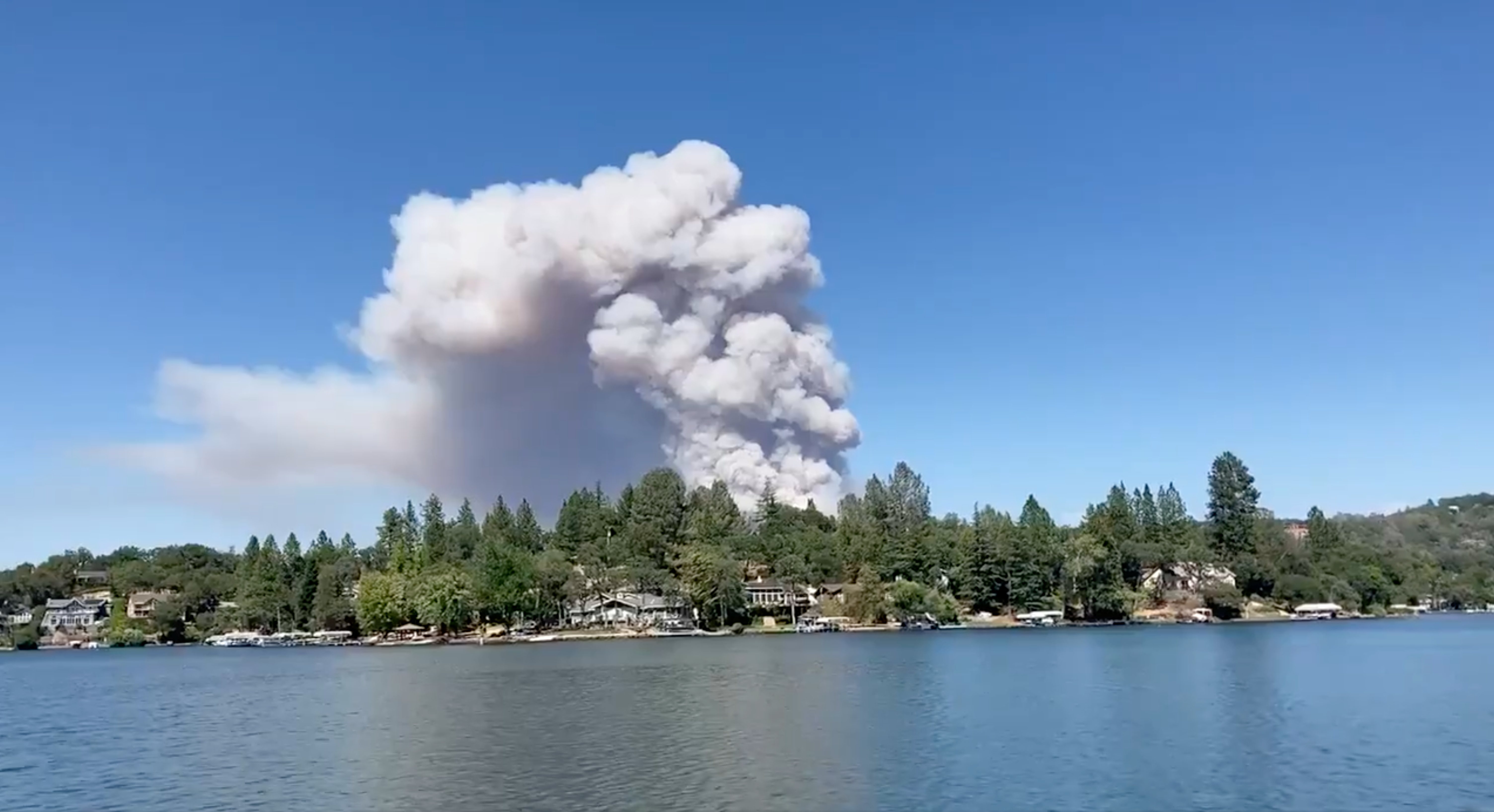 Wildfire blazes in Lake of the Pines, California, U.S., August 4, 2021, in this screen grab obtained from a social media video. TWITTER @DennisKPIX/via REUTERS 
