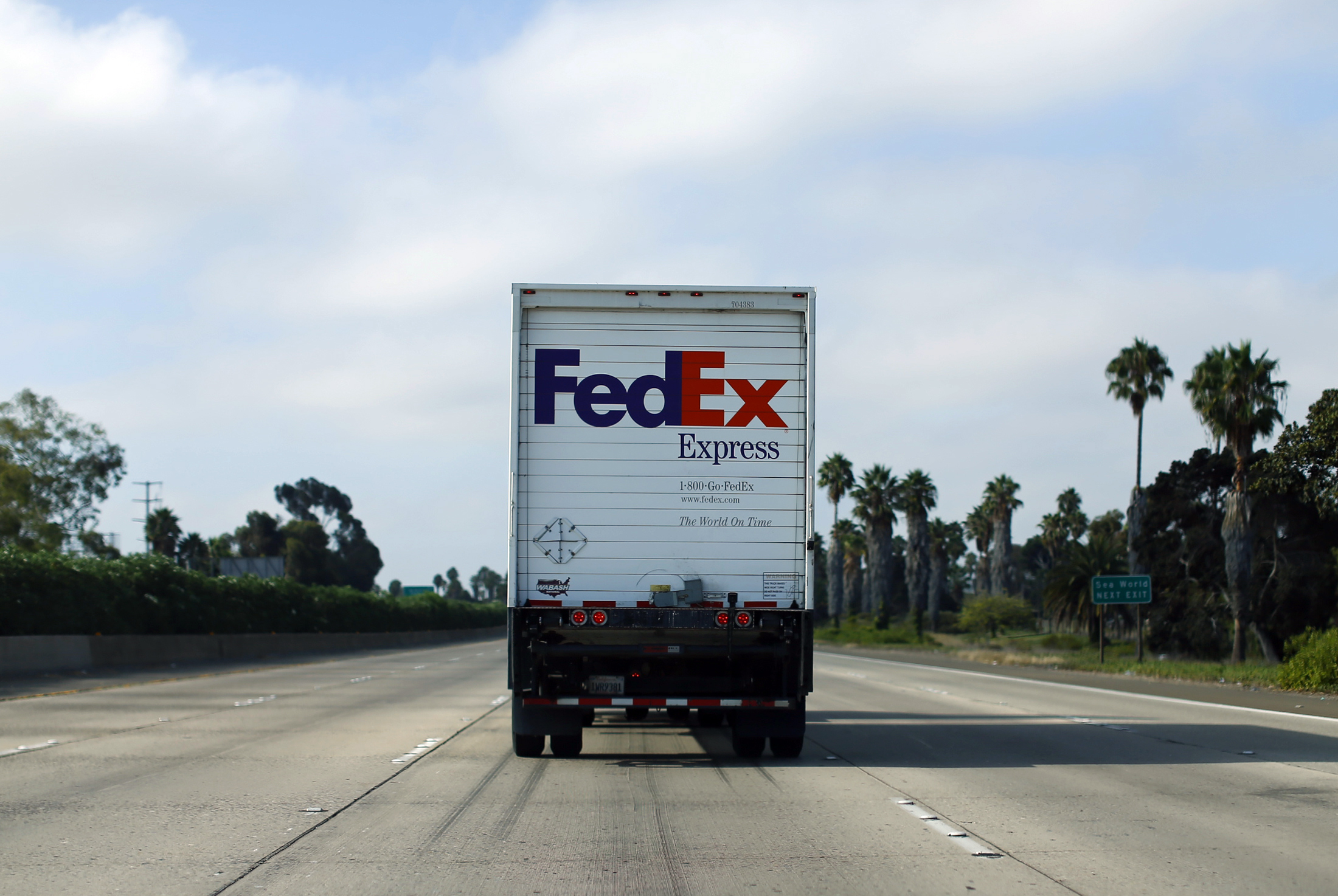 Federal Express truck makes its way down a freeway in San Diego, California