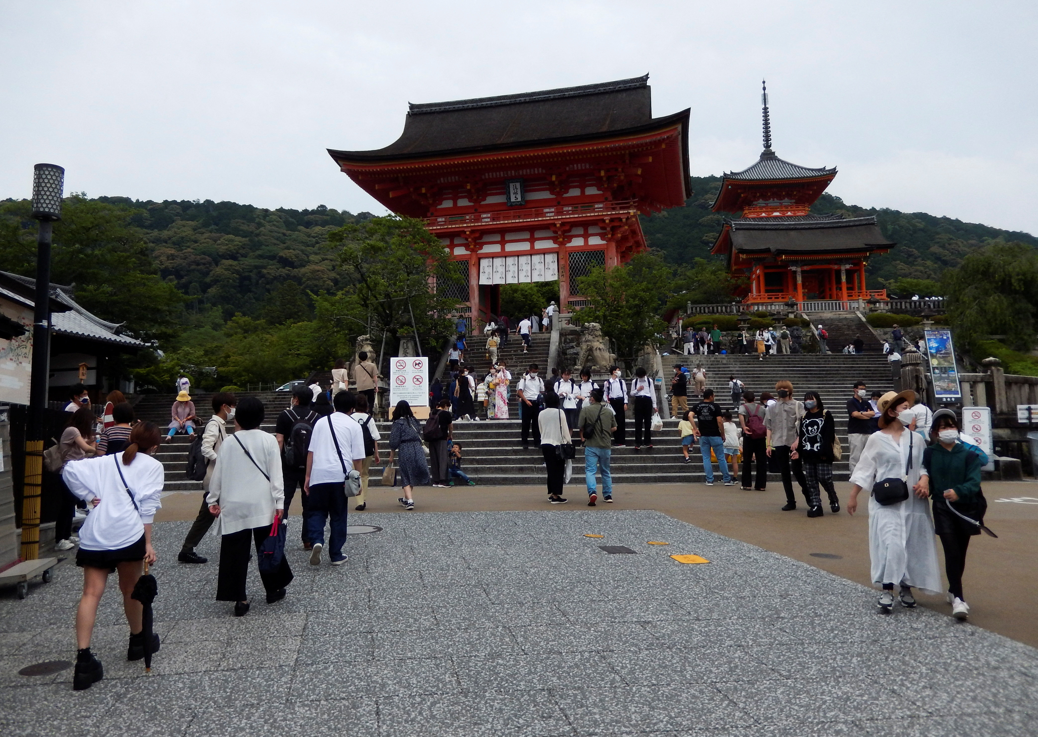 Visitors stroll at Kiyomizu-dera temple, a popular attraction among tourists, in Kyoto