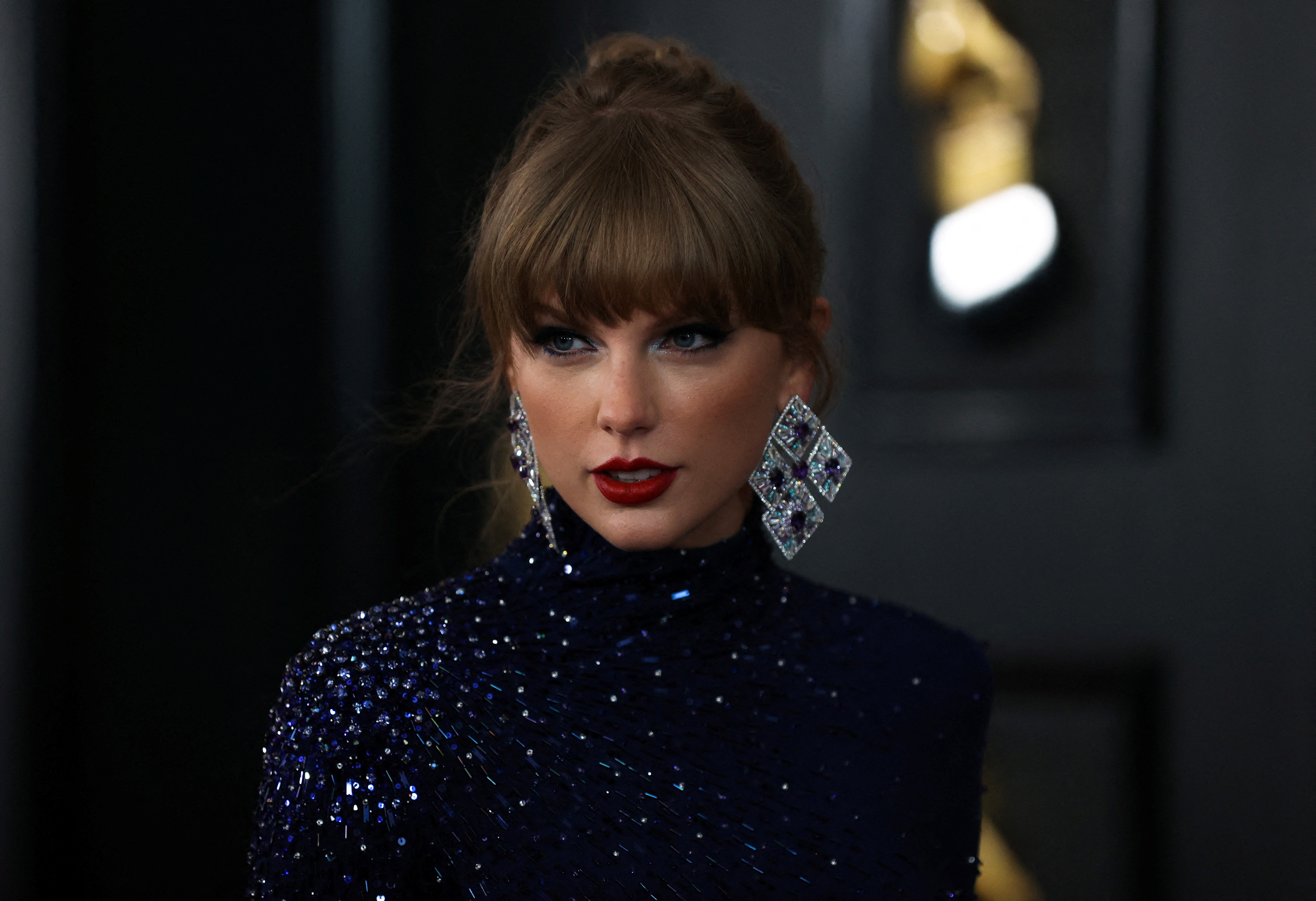Taylor Swift is asking fans to buy her merchandise for a better